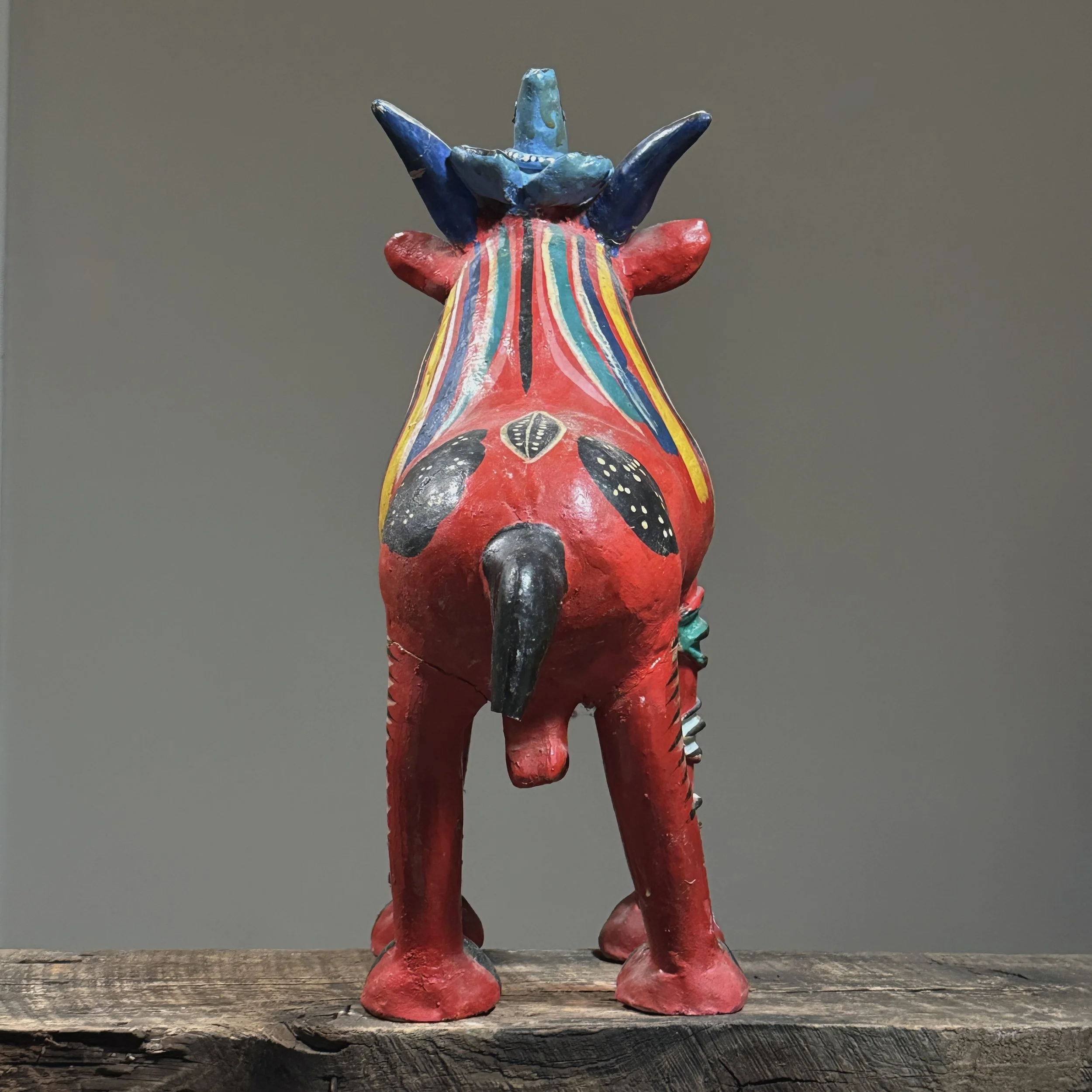 Rear view of a Candelario Medrano polychrome ceramic sculpture showcasing its hand-built construction