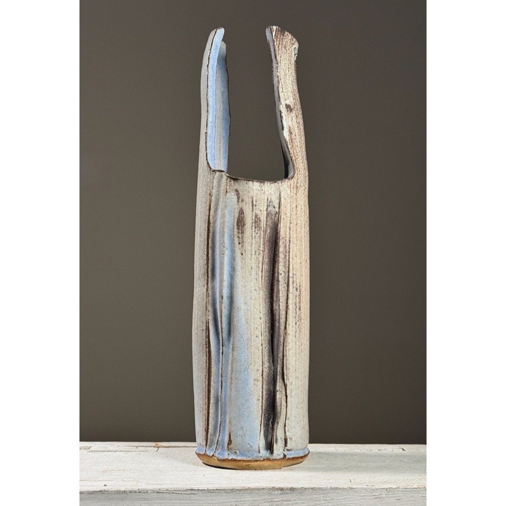 Full frontal view of a large vintage wood-fired ikebana vase by Seiko Kato Behr with faceted form