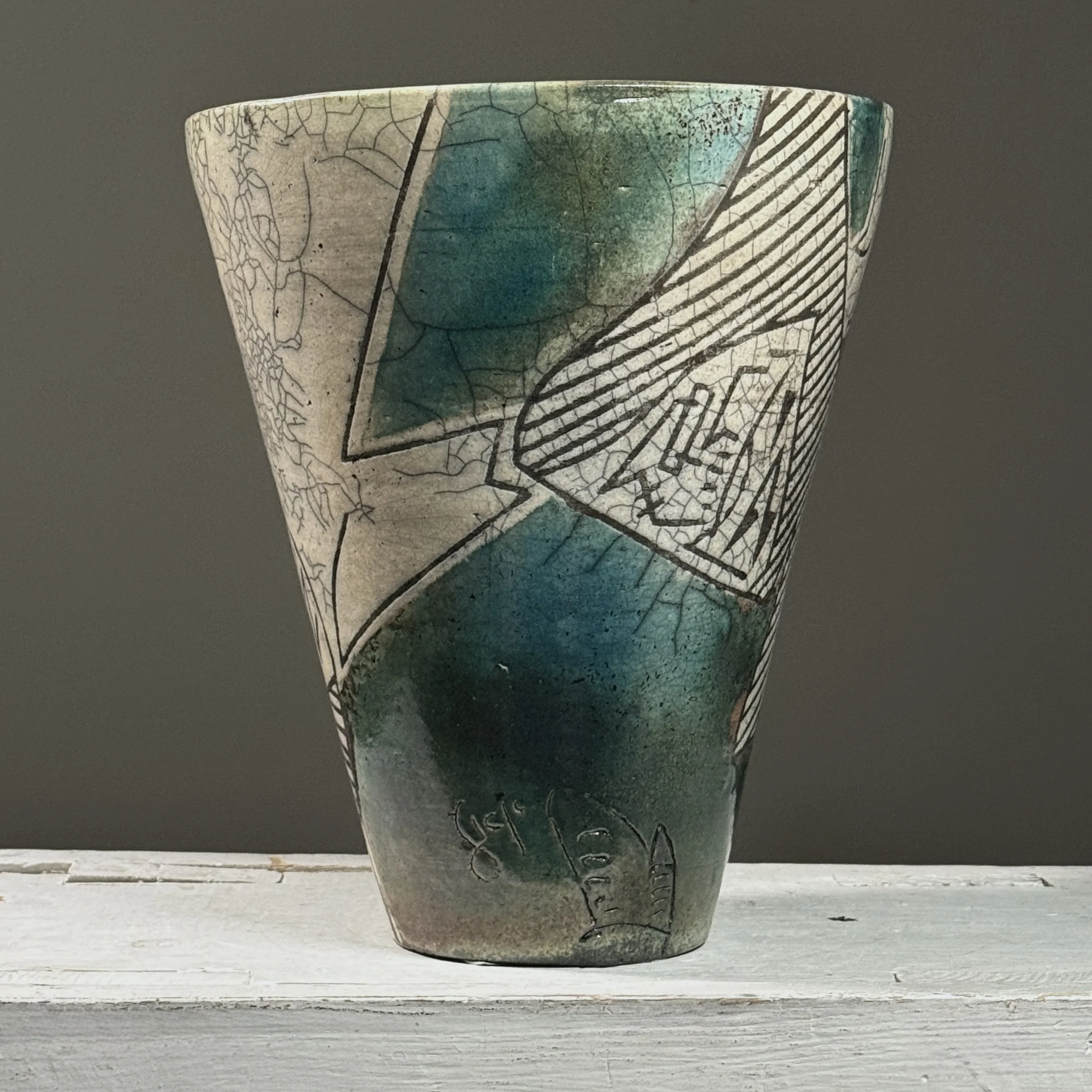 Full view of vintage 1984 postmodernist raku crackle glaze ceramic vessel, signed on side, blue-green glaze areas and black line detail