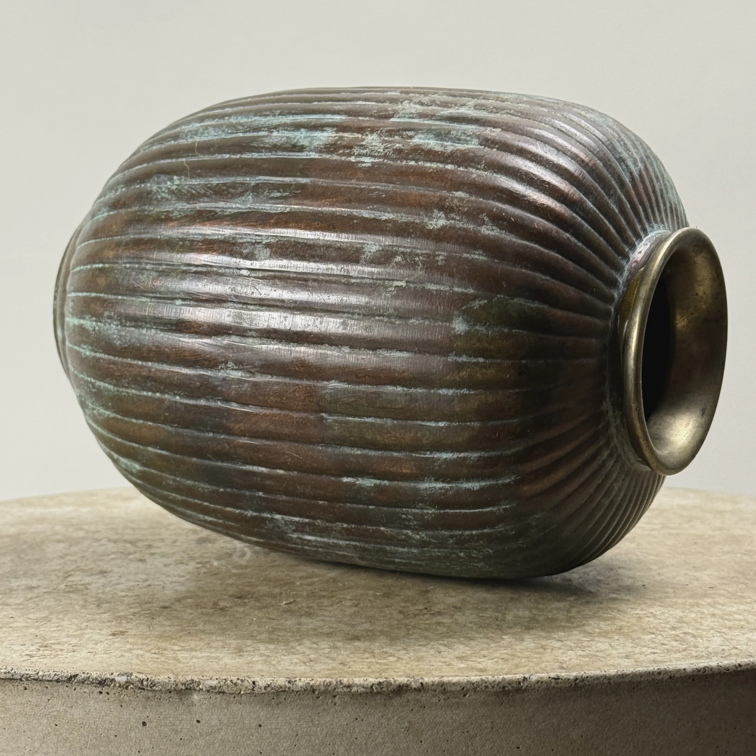 Overview of antique Art Deco patinated brass ribbed vase, metal, verdegris, greyish-brown surface, 7.75 inches tall