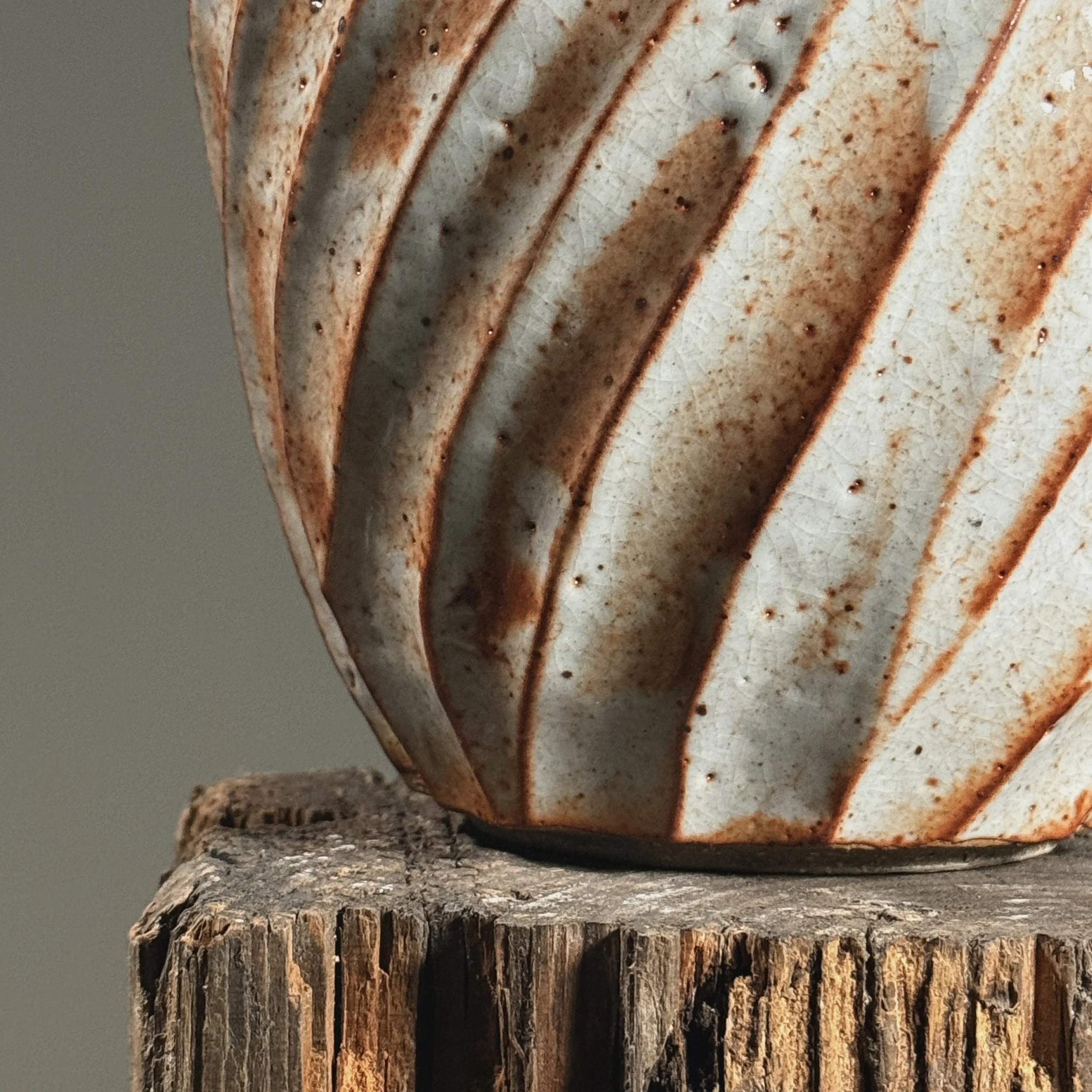 Detail of the Shino glaze surface showing thick white field.