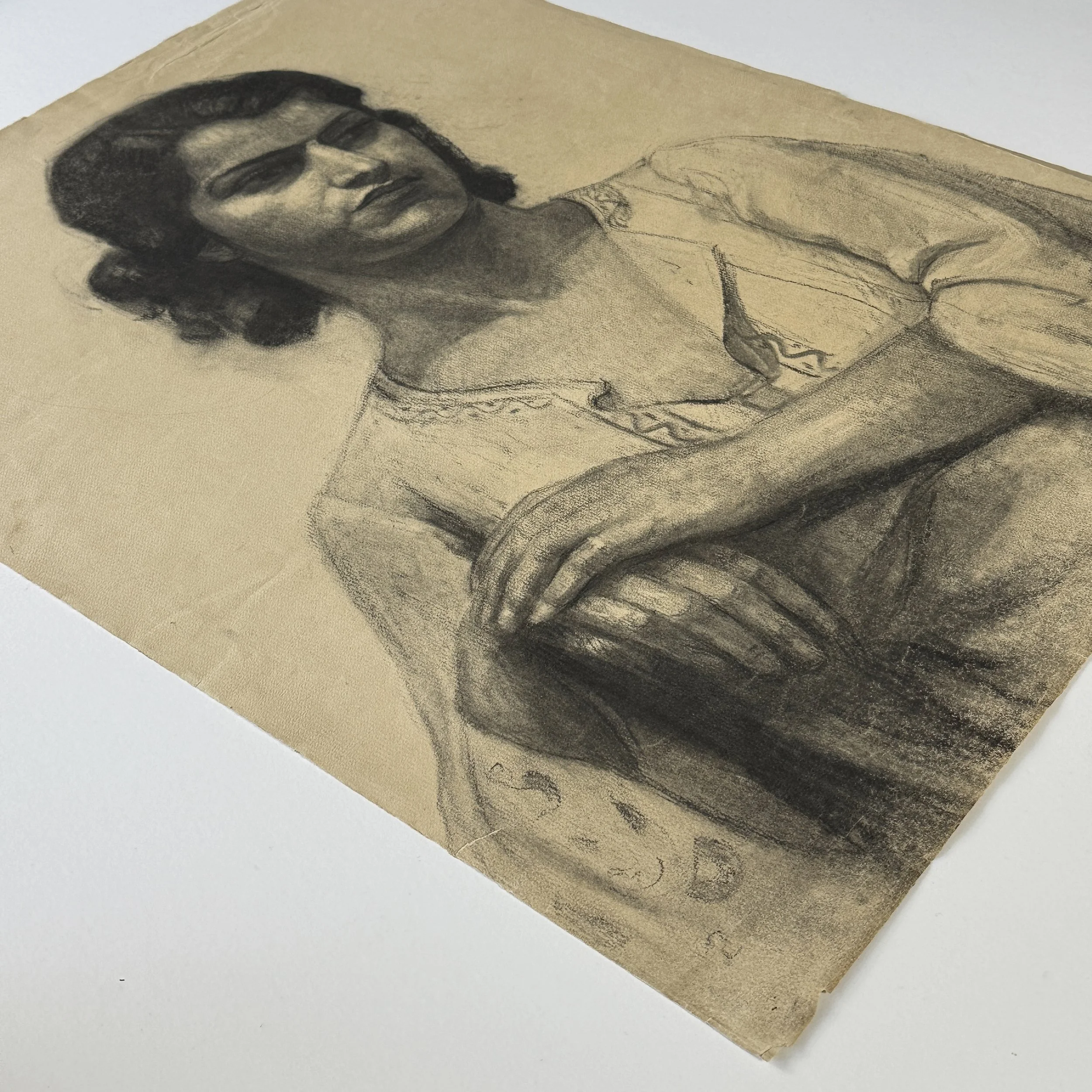 Realist rendering of a peasant woman’s face in charcoal