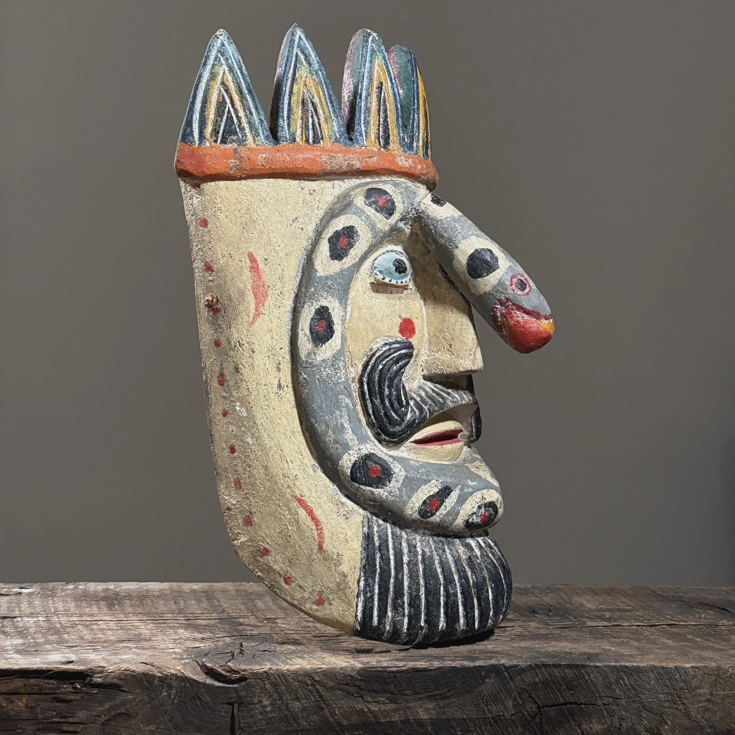 Profile view of the mask showing depth and carving style.