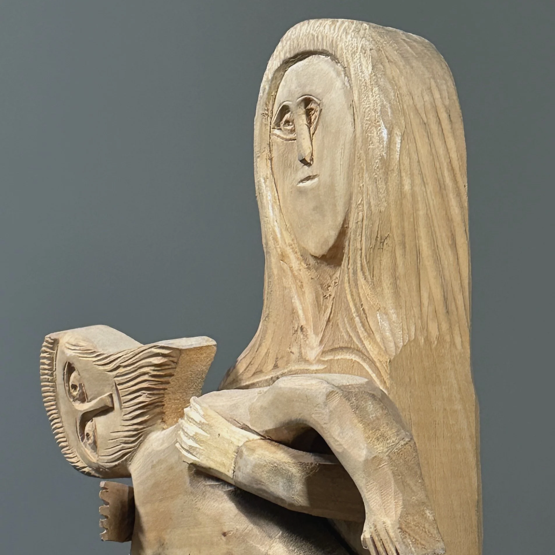 Profile view showing the shallow relief depth of the sculpture.