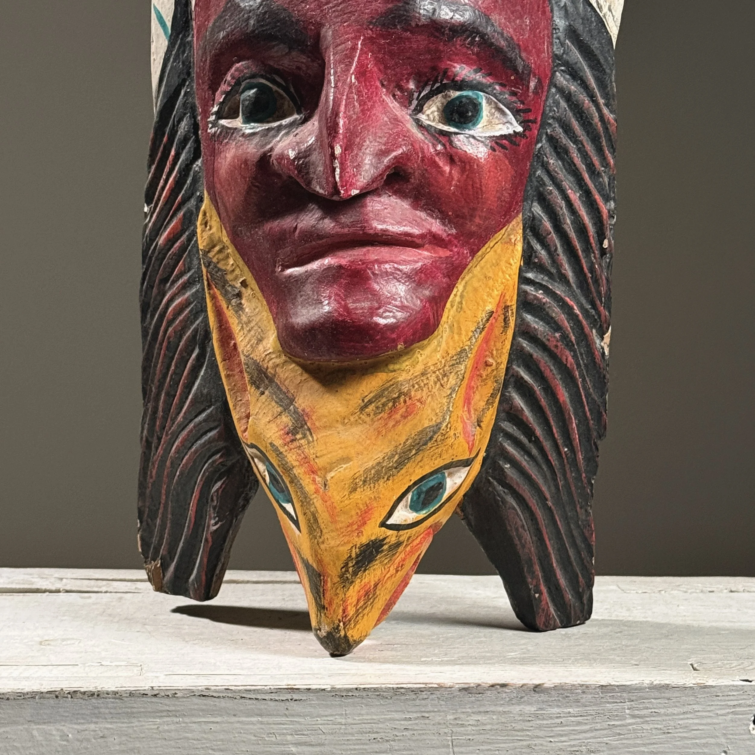 Detail of fox/dog carving and integration with the human face.