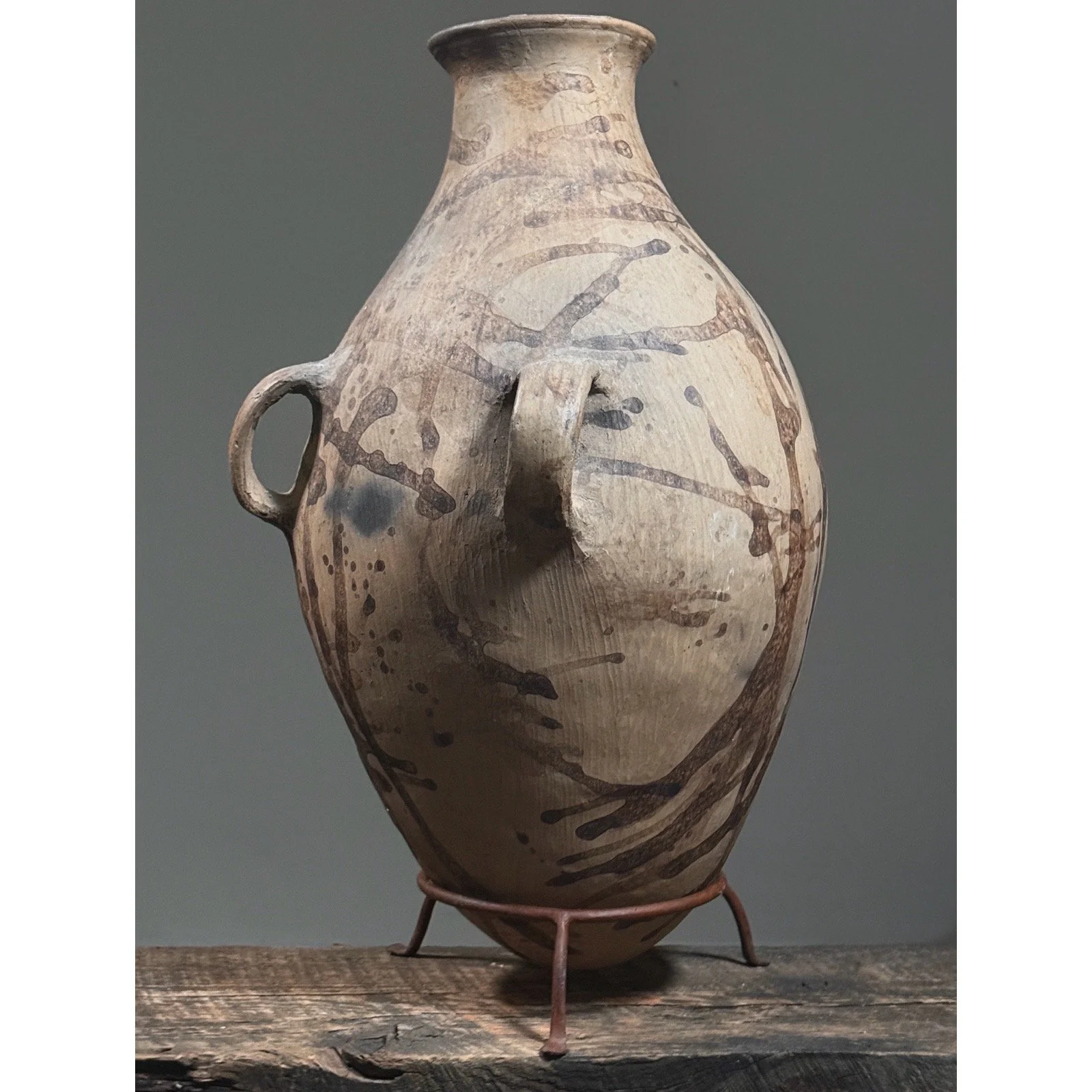Side view of large Tonaltepec amphora vessel on display stand