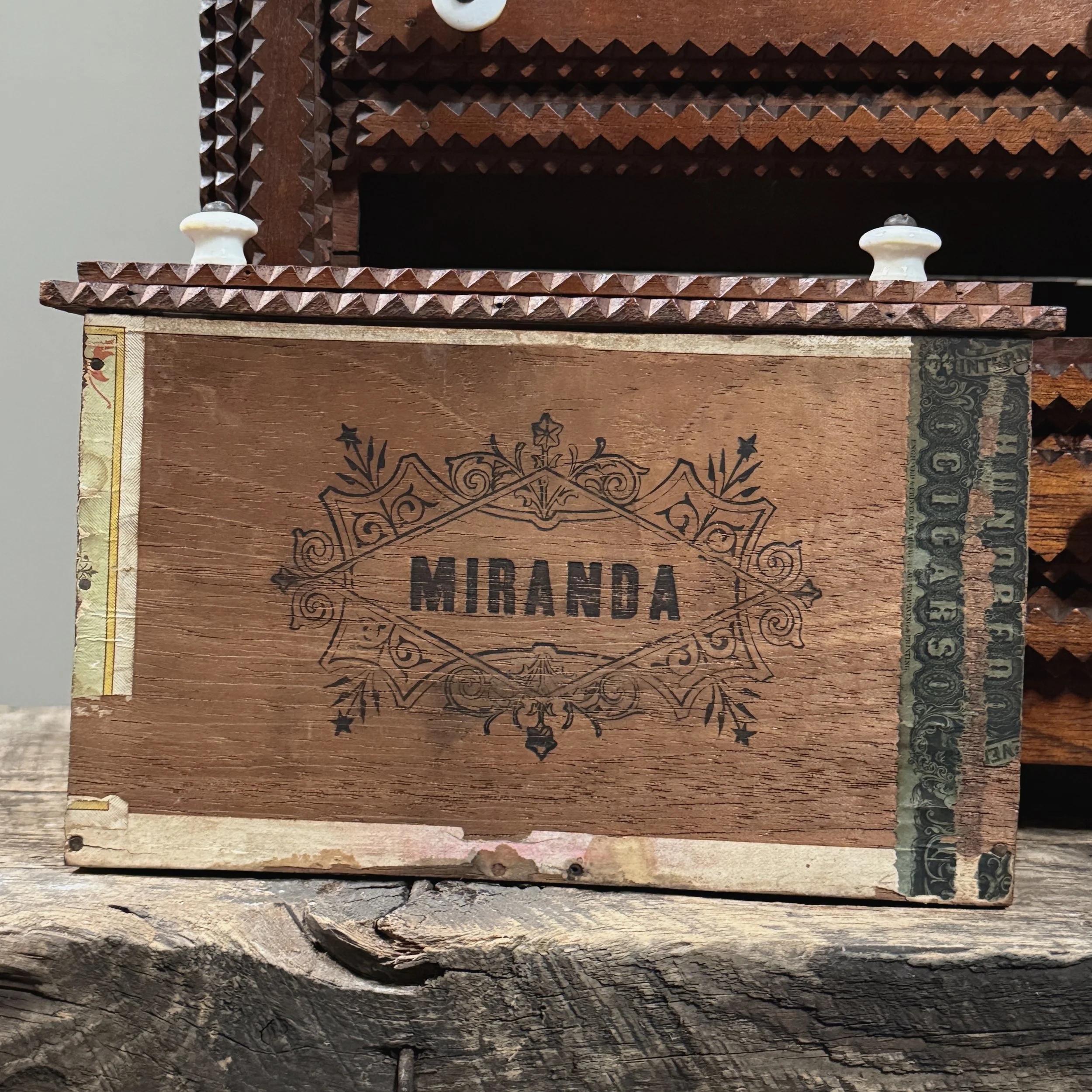 Open drawer showing the original vintage cigar box paper lining.