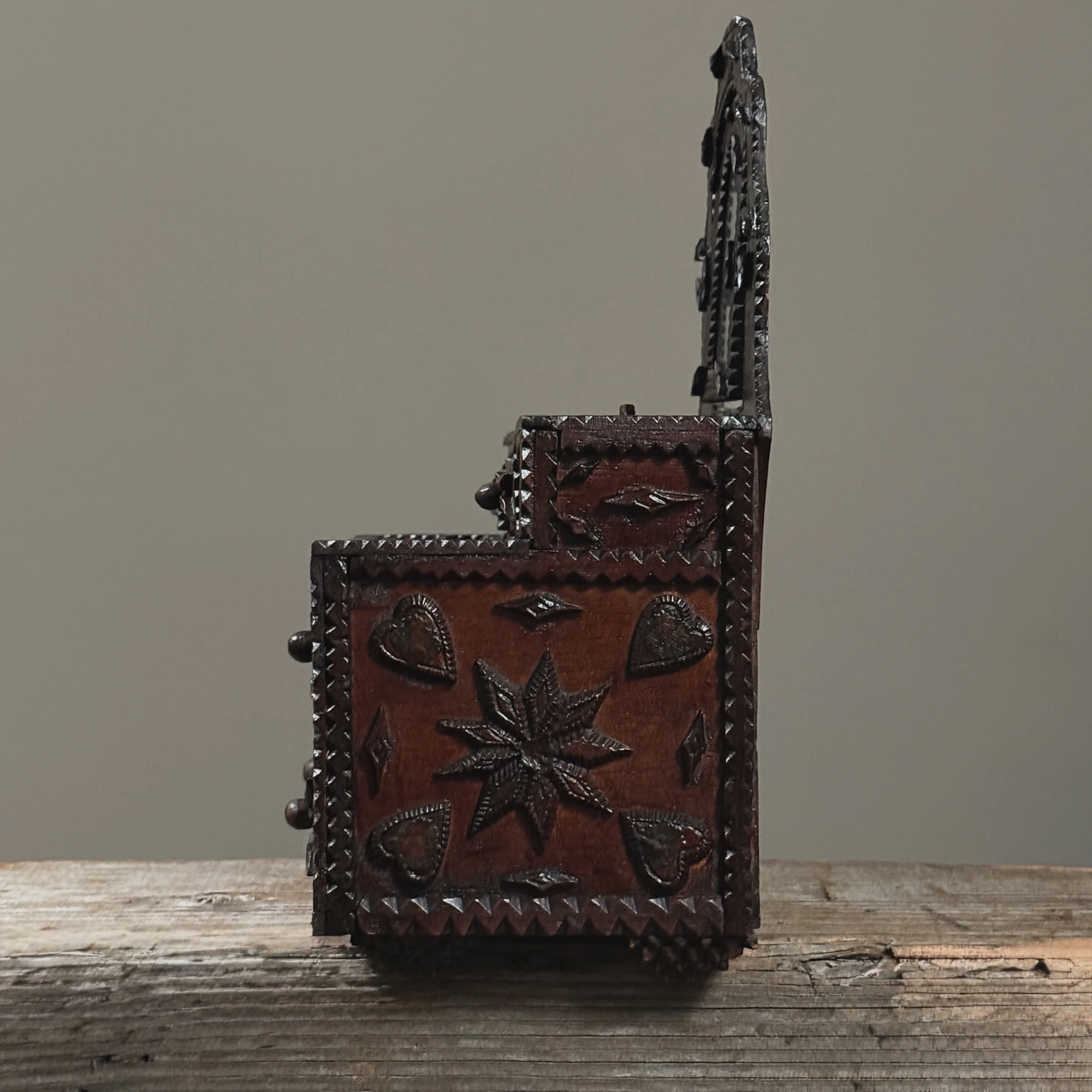 Angled view of dresser emphasizing depth and dimensional carving