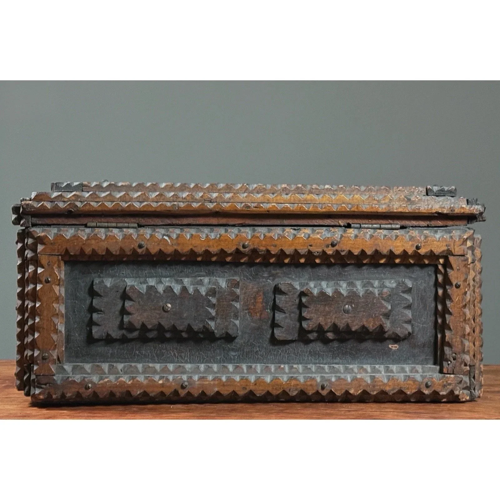 Front view of the monumental tramp art chest, showing its full scale.