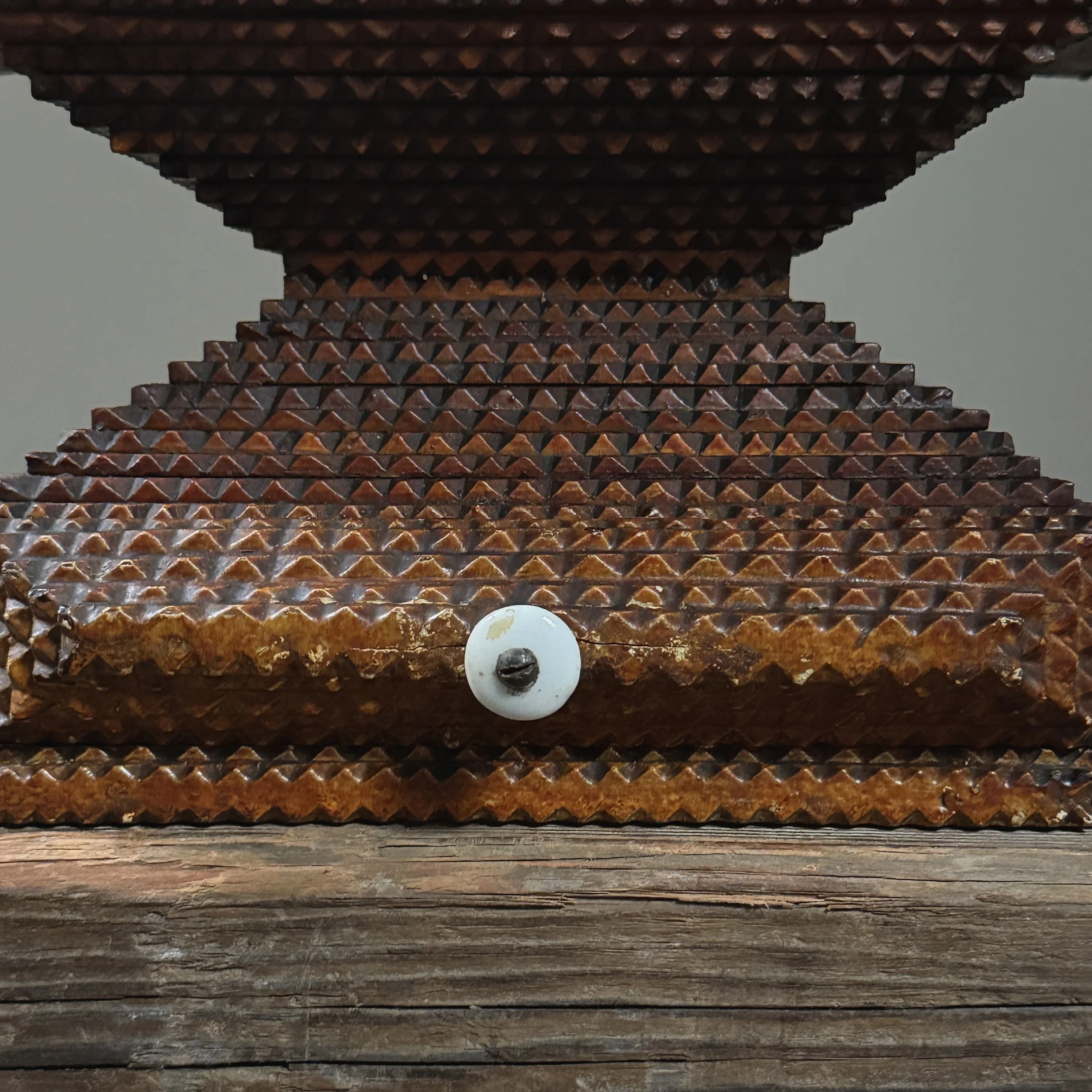 Close-up of original white drawer pull on tramp art box
