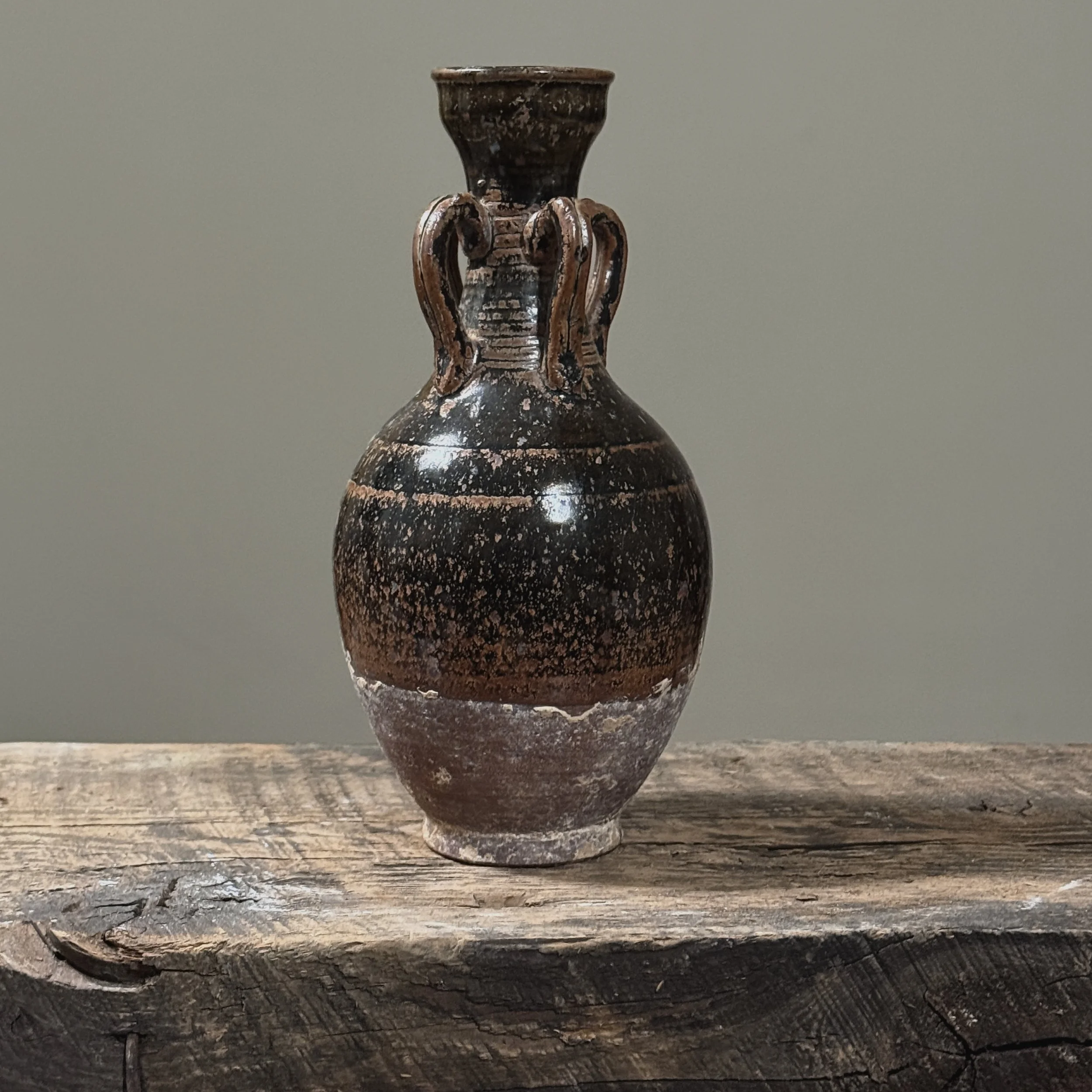 Full front view of antique four handled brown speckled glazed stoneware vessel, Cizhou kiln style amphora, 8 inches tall