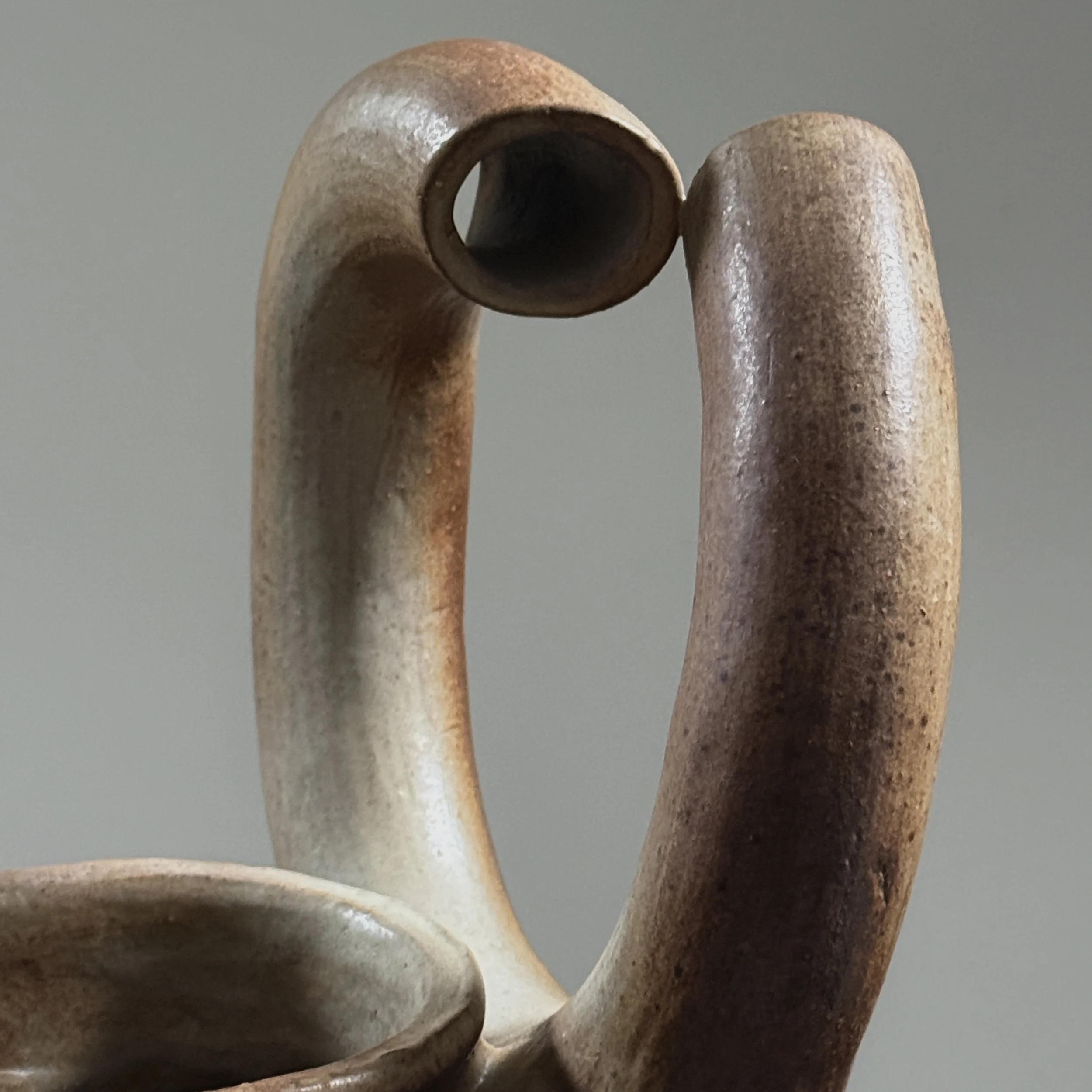 Broken circle handle detail, deconstructed ceramic vase