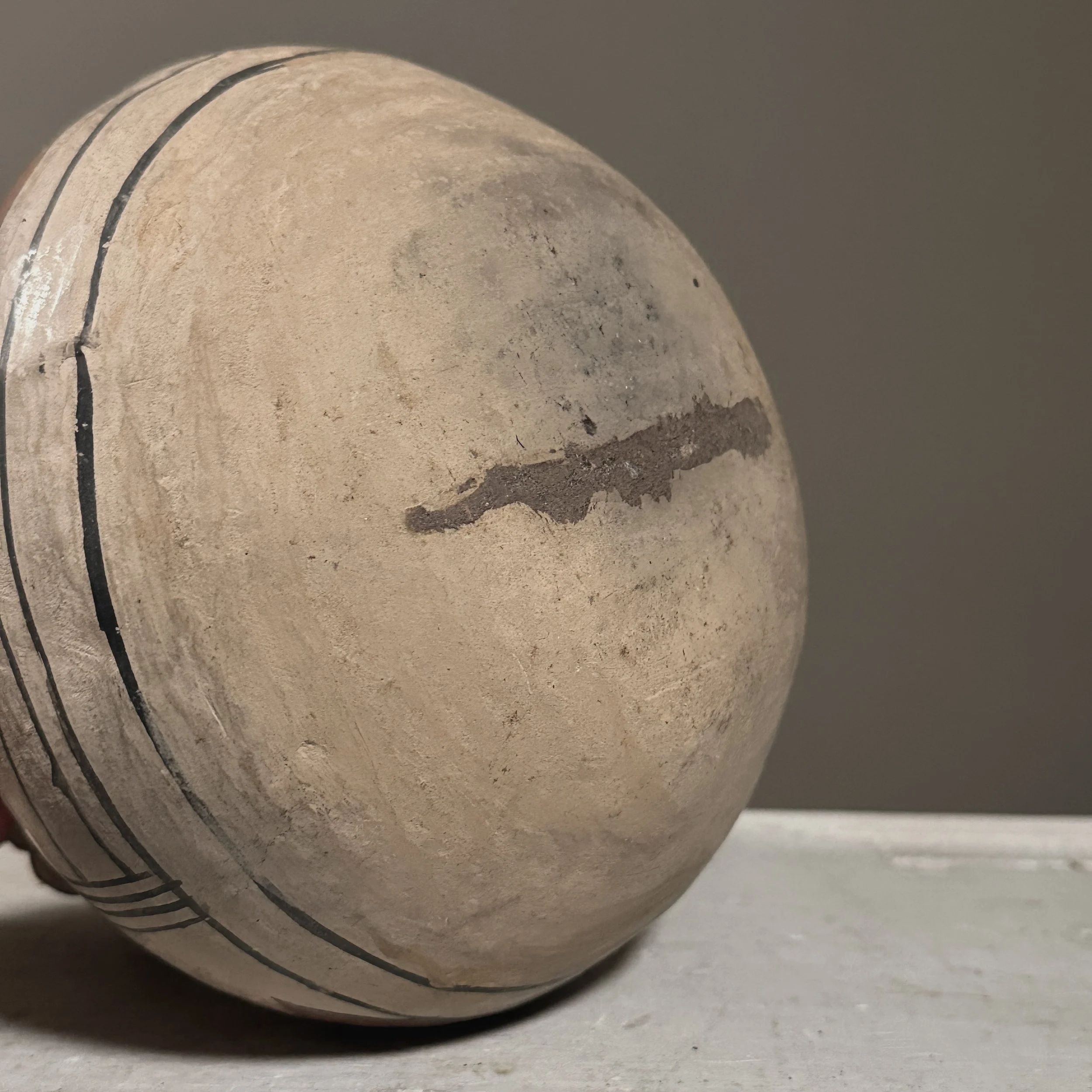 Painted geometric patterns on effigy vessel