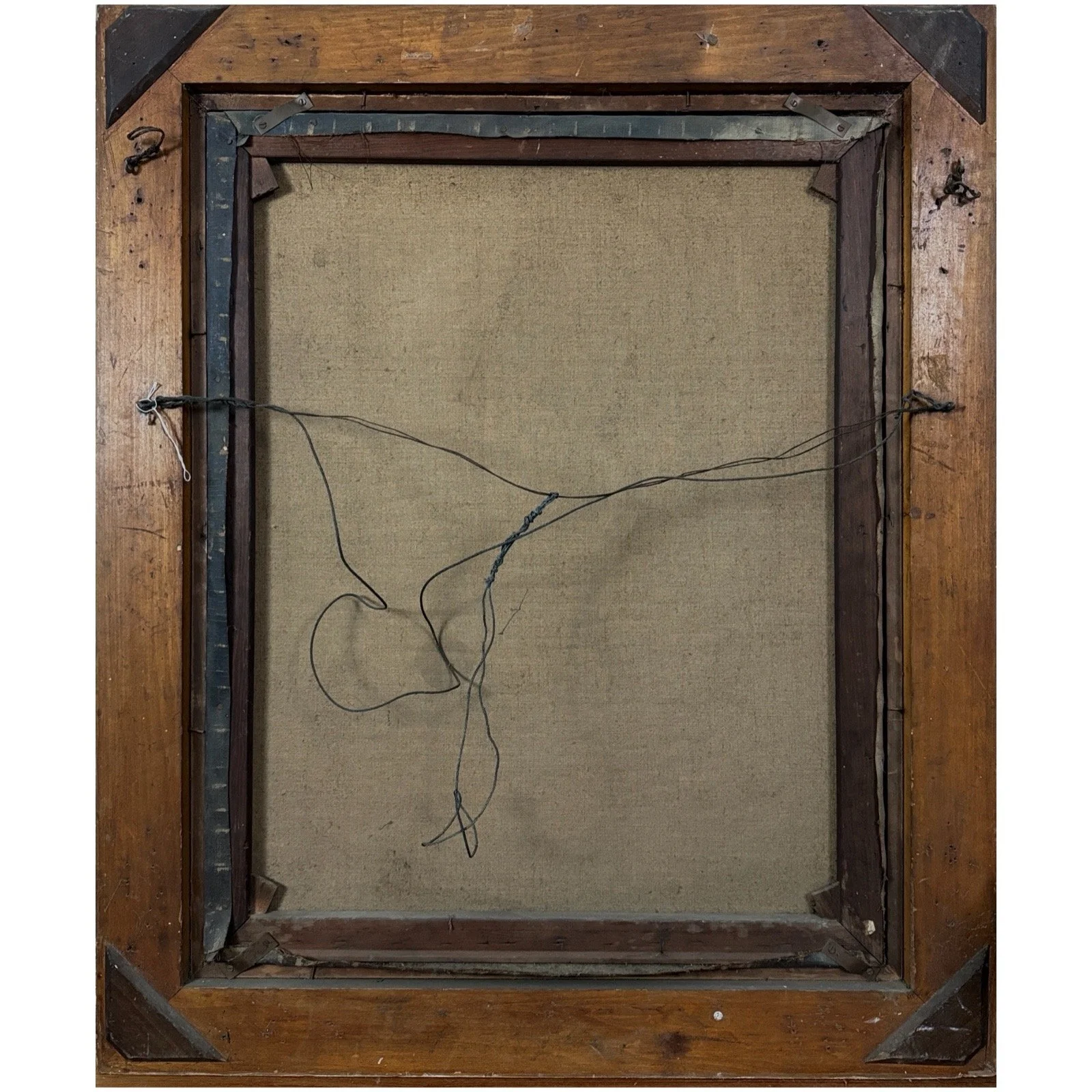 View of the painting's reverse, showing stretcher bars and canvas backing.
