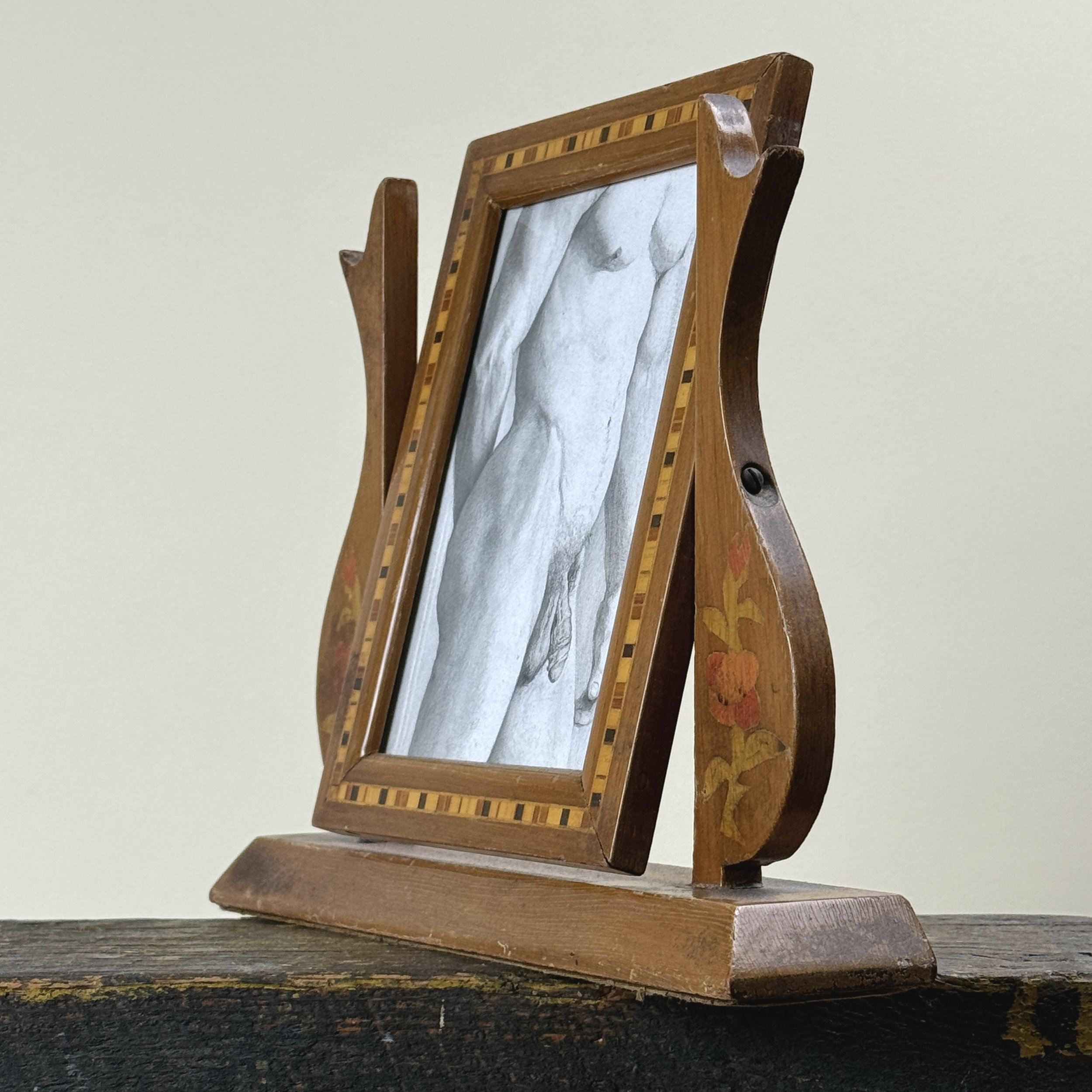 Side view of Realist graphite drawing of male nude in antique Art Nouveau frame with rose inlay. 9.5 by 11 inches.