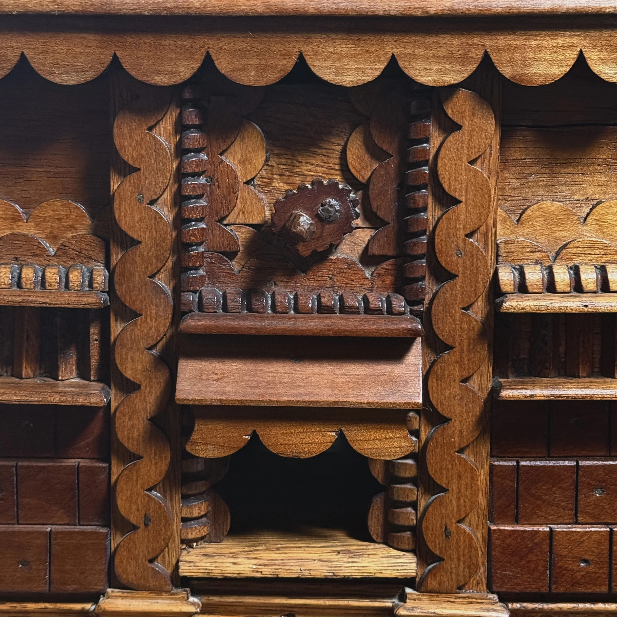 Close-up detail of layered "squiggly" scrollwork ornamentation on a vintage folk art box