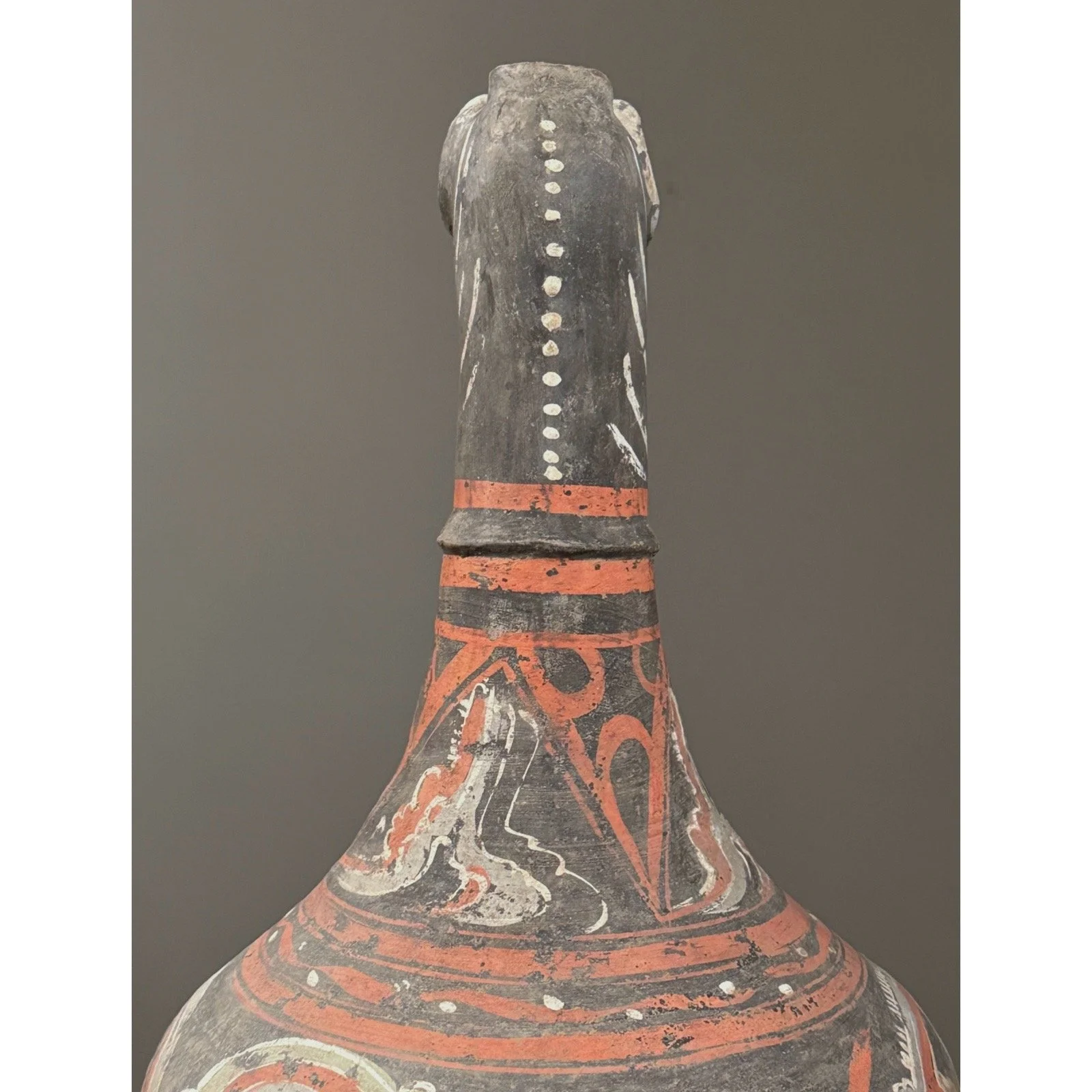 Painted details on dark grey Chinese zun vessel