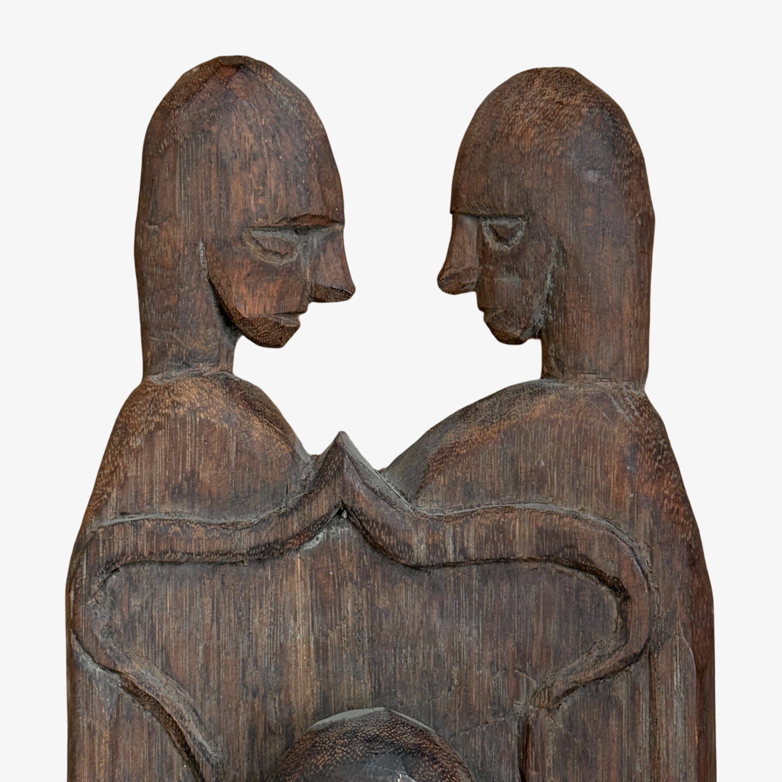 Two sculpted heads of hand carved wood sculpture