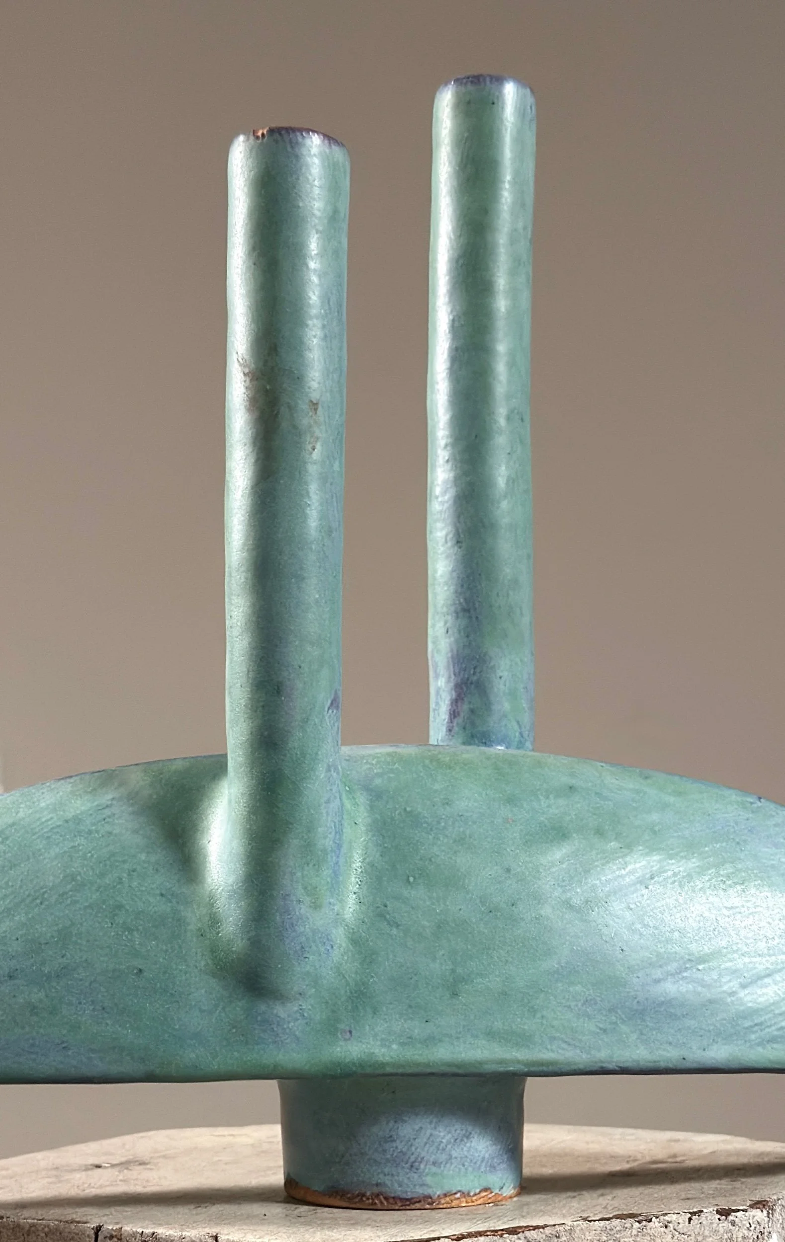 Dual chambers emerging from narrow oval body, turquoise glazed ceramic