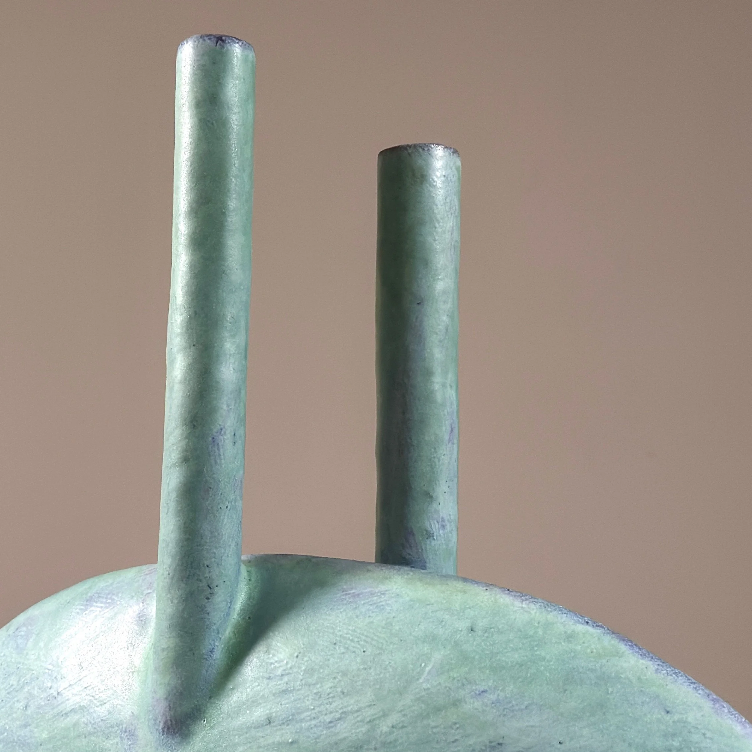 Dual chambers emerging from narrow oval body, turquoise glazed ceramic