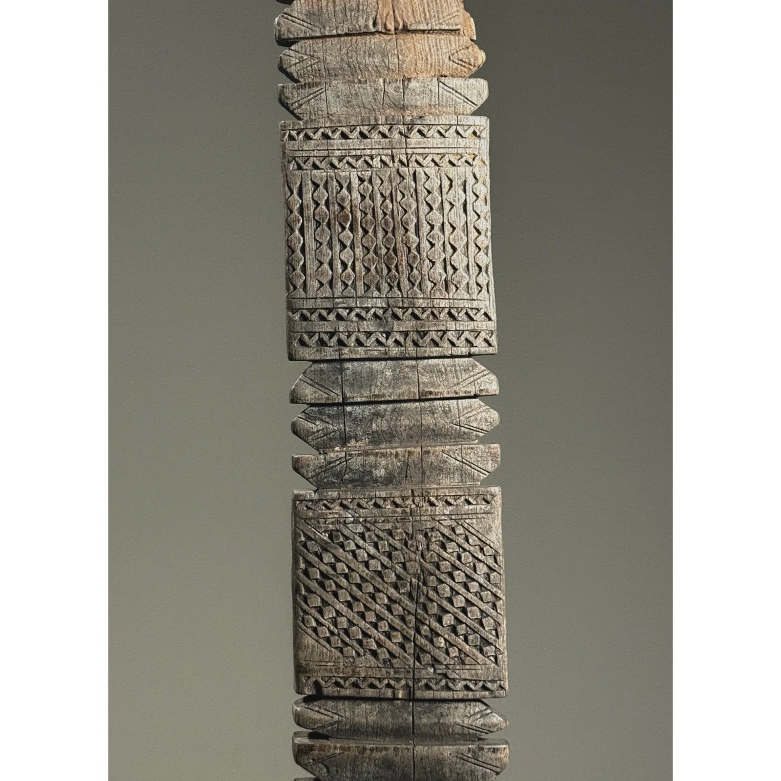 Close-up of geometric patterns and carving technique.