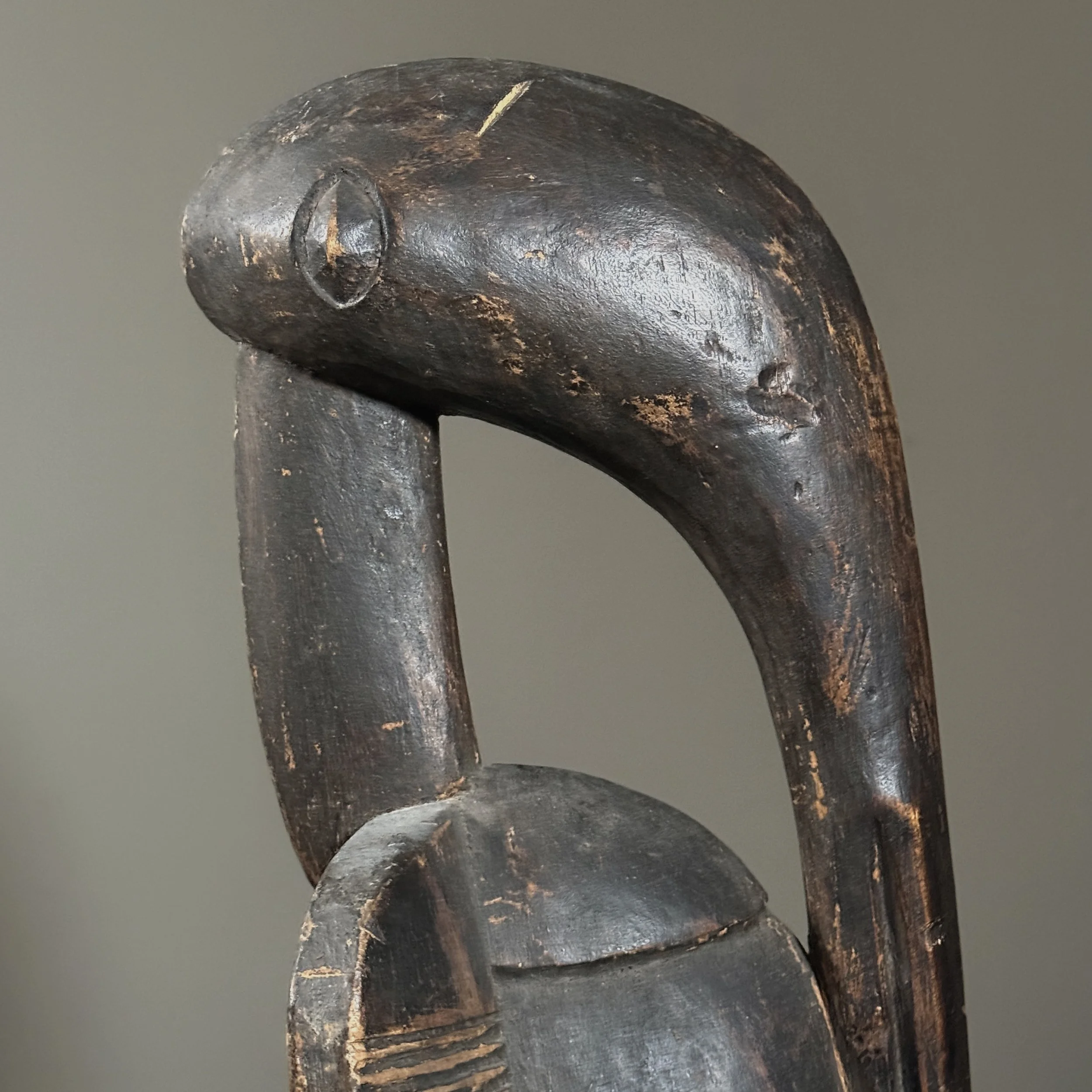 Side view of antique Senufo Calao bird sculpture