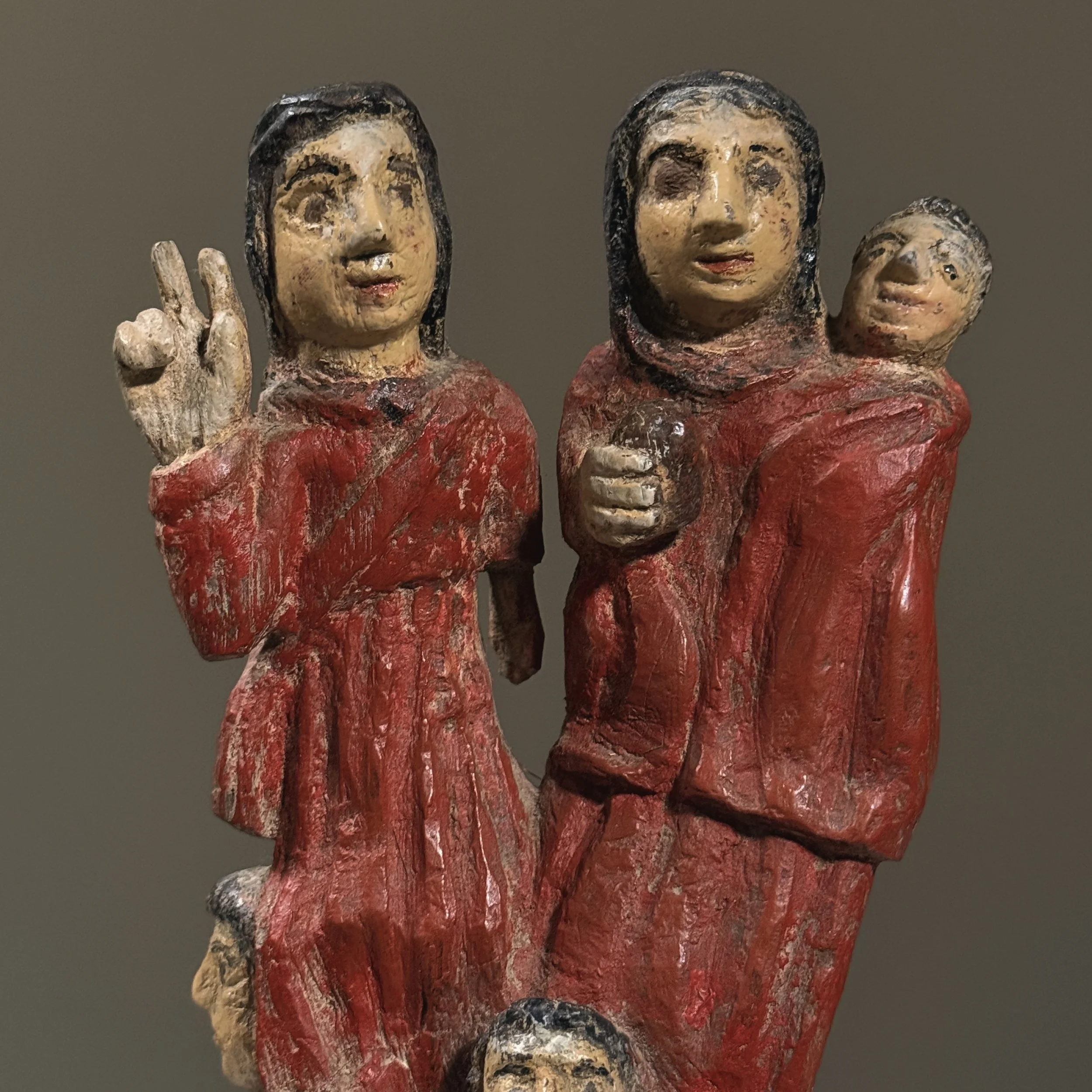 Upper section with man holding child beside woman