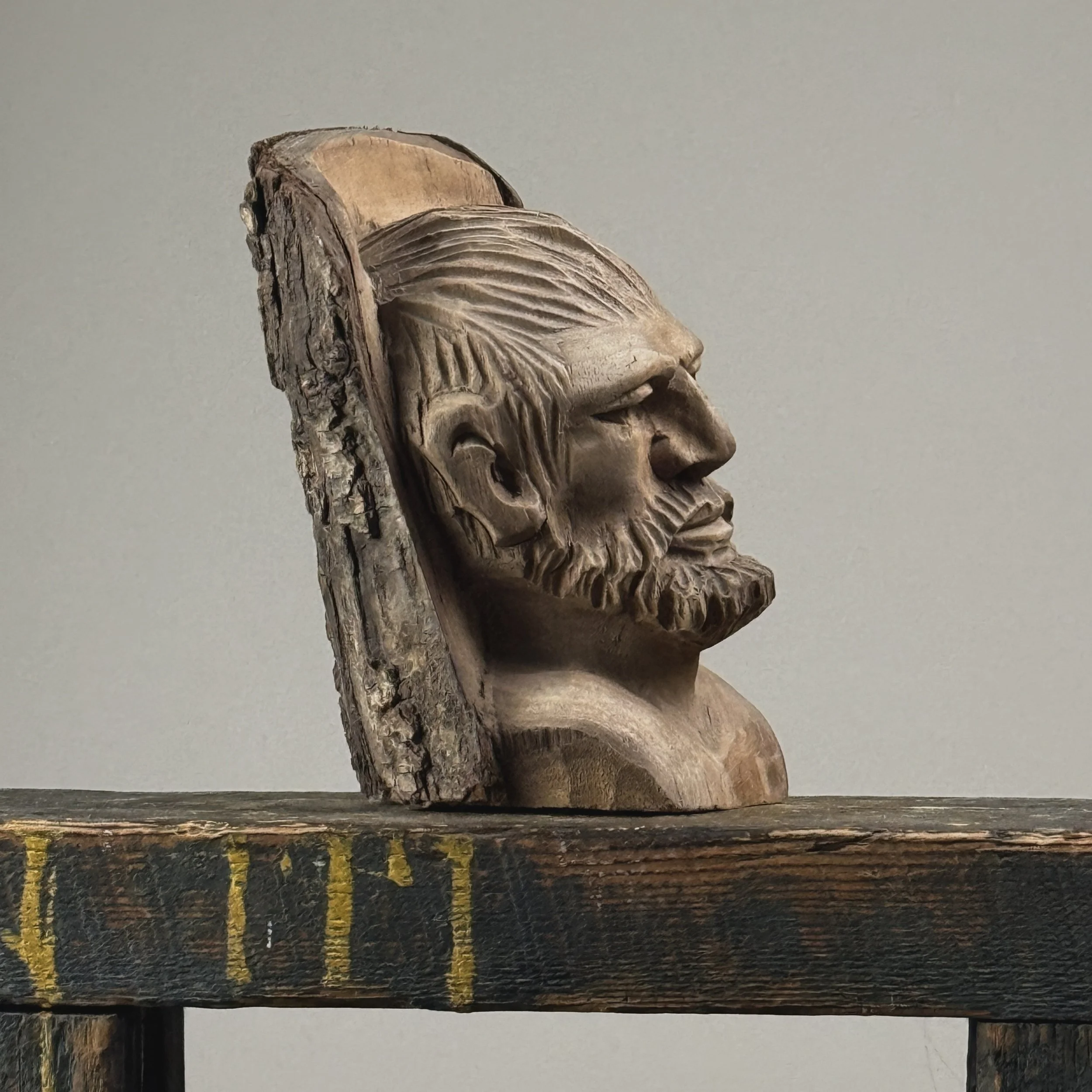 Vintage hand-carved folk art portrait of a bearded man sculpture