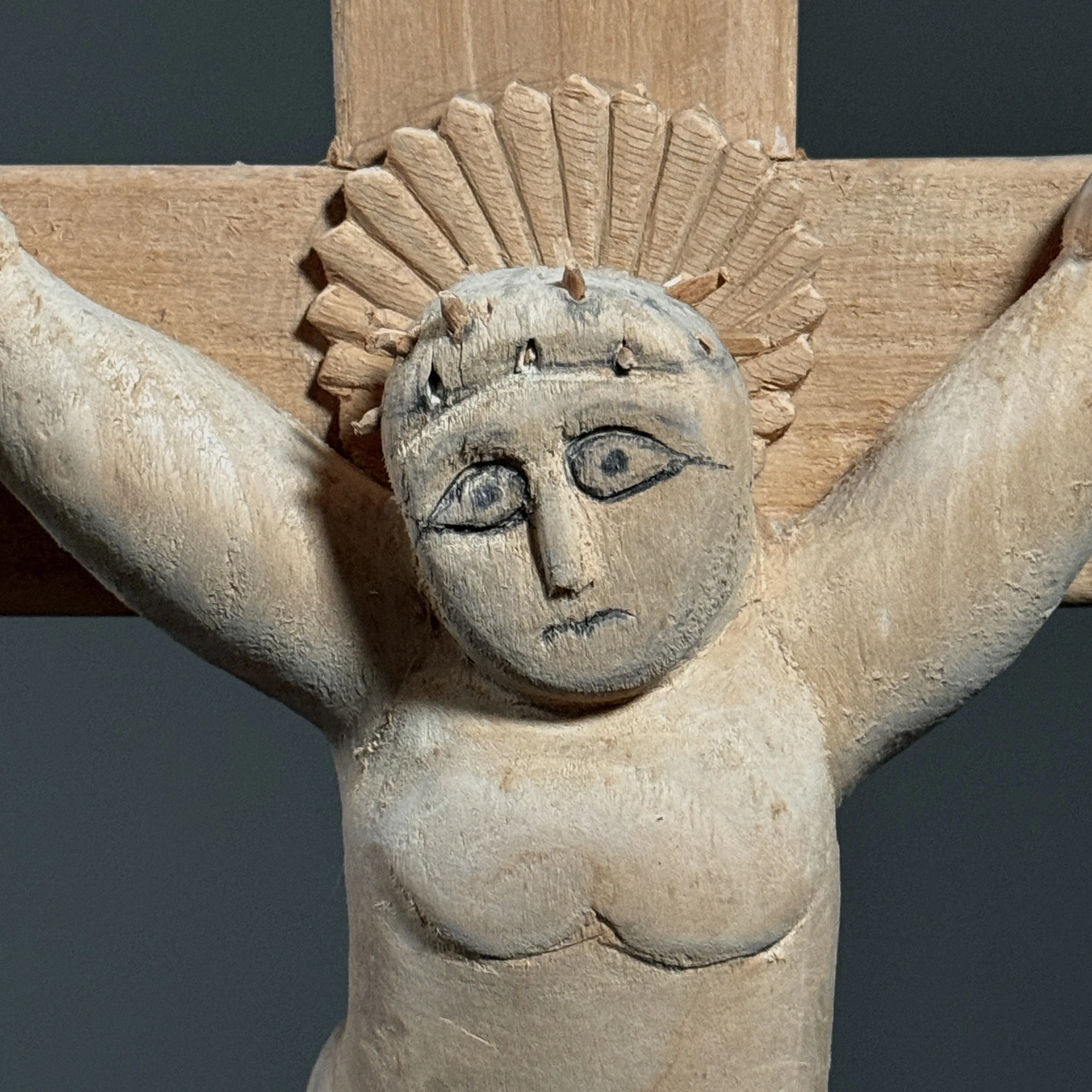 Top section of crucifix with JNKZ plaque close-up