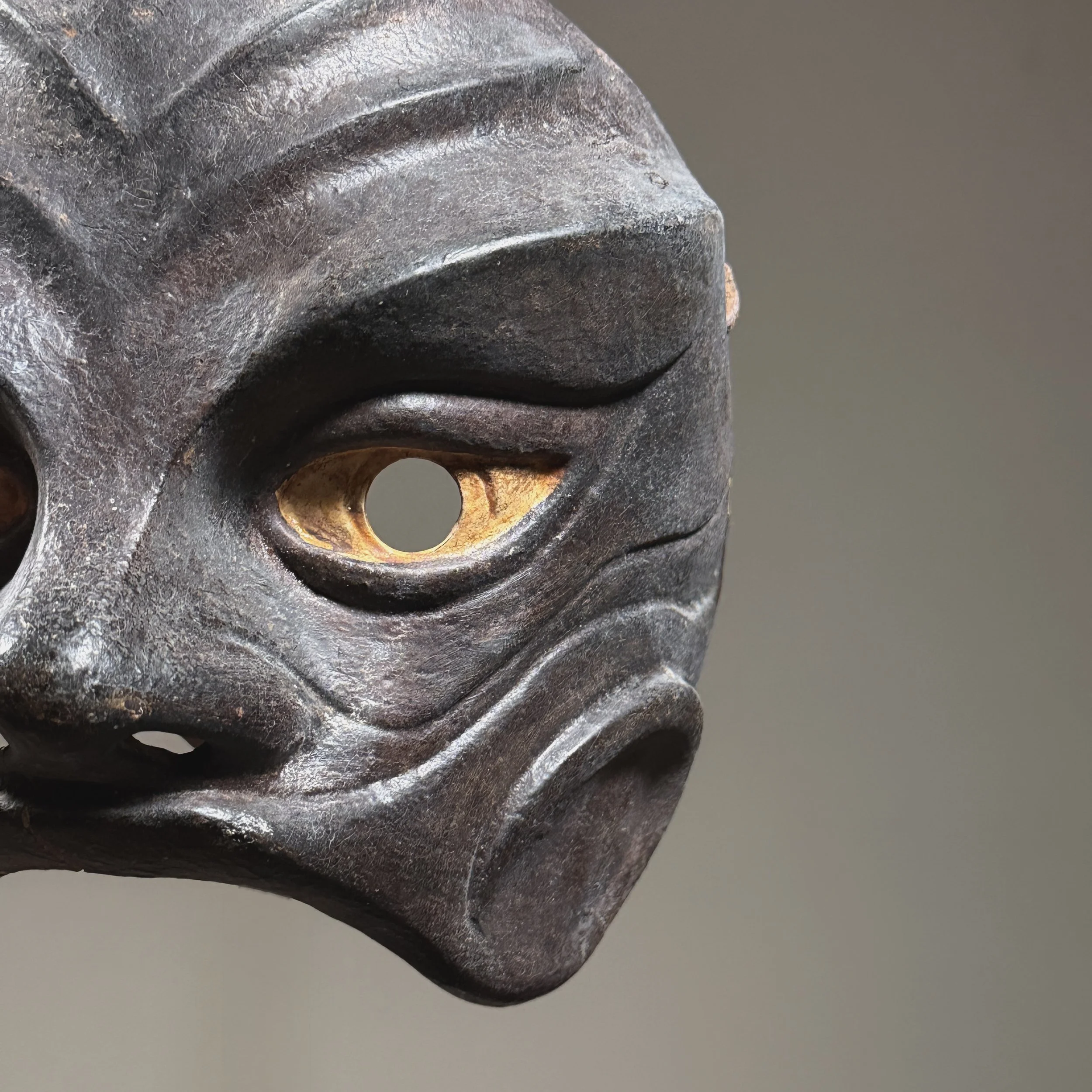 Modernist interpretation of Commedia dell’arte mask in brown leather over sculpted form.