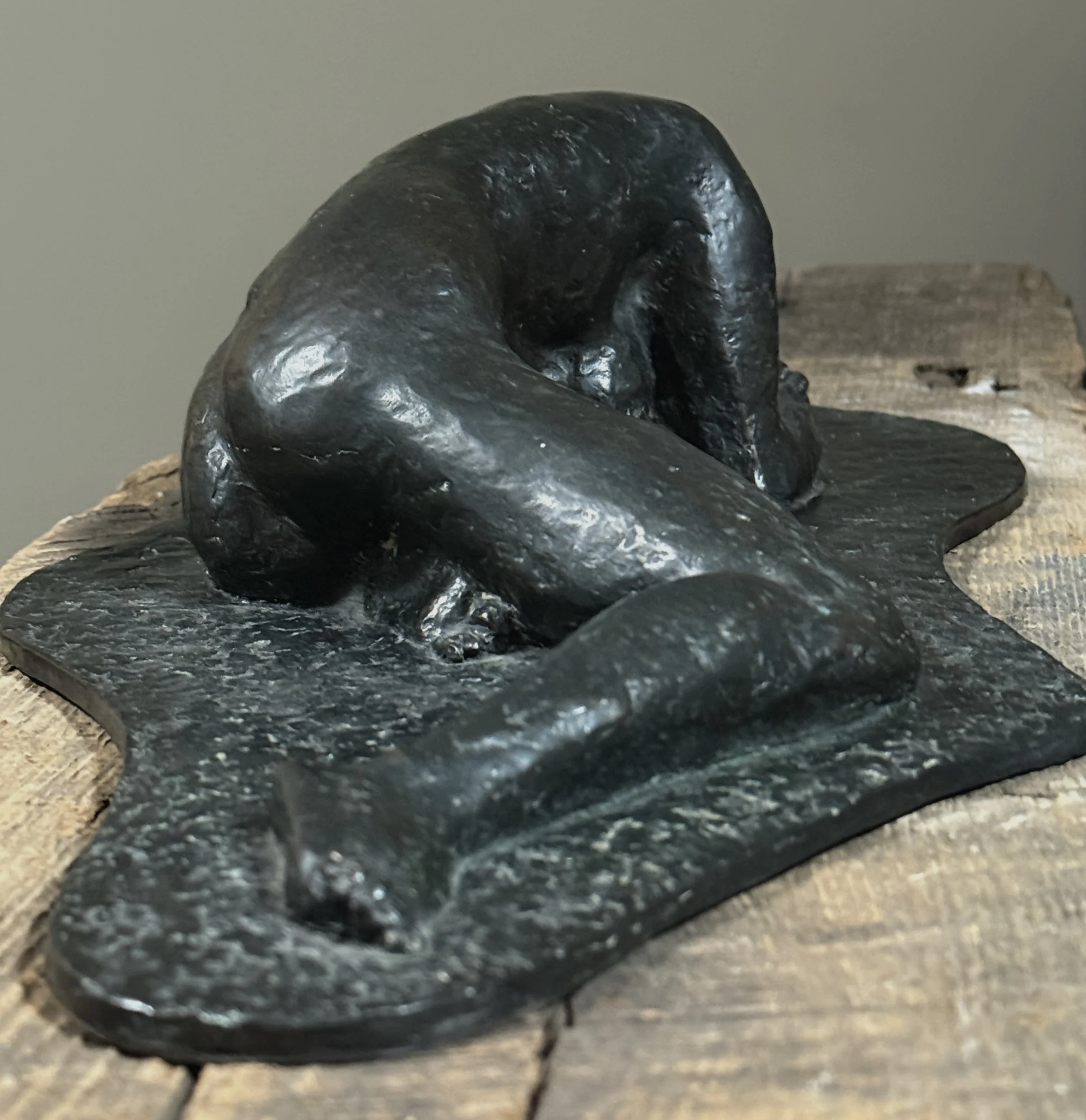 Textured bronze surface on expressionist nude sculpture