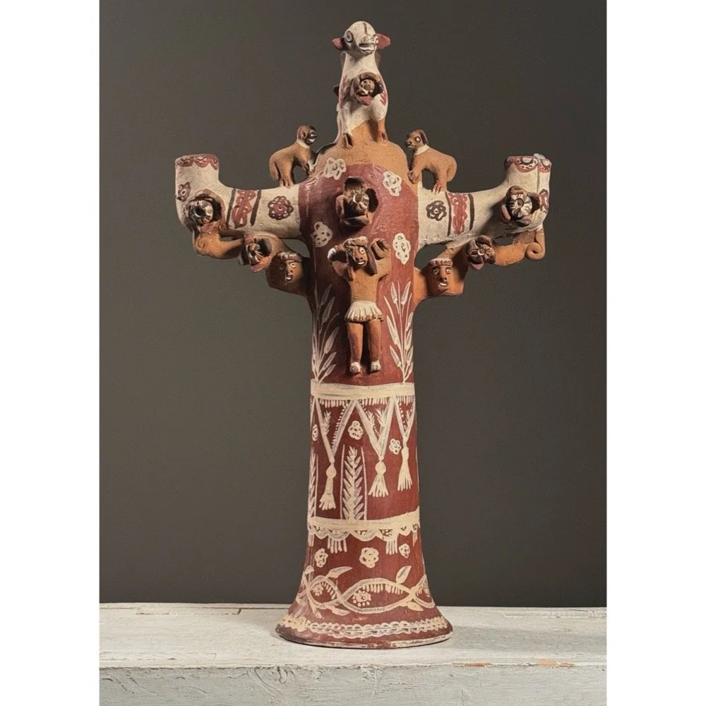 Full frontal view of a vintage polychrome folk art candelabra with Jesus and animal figures