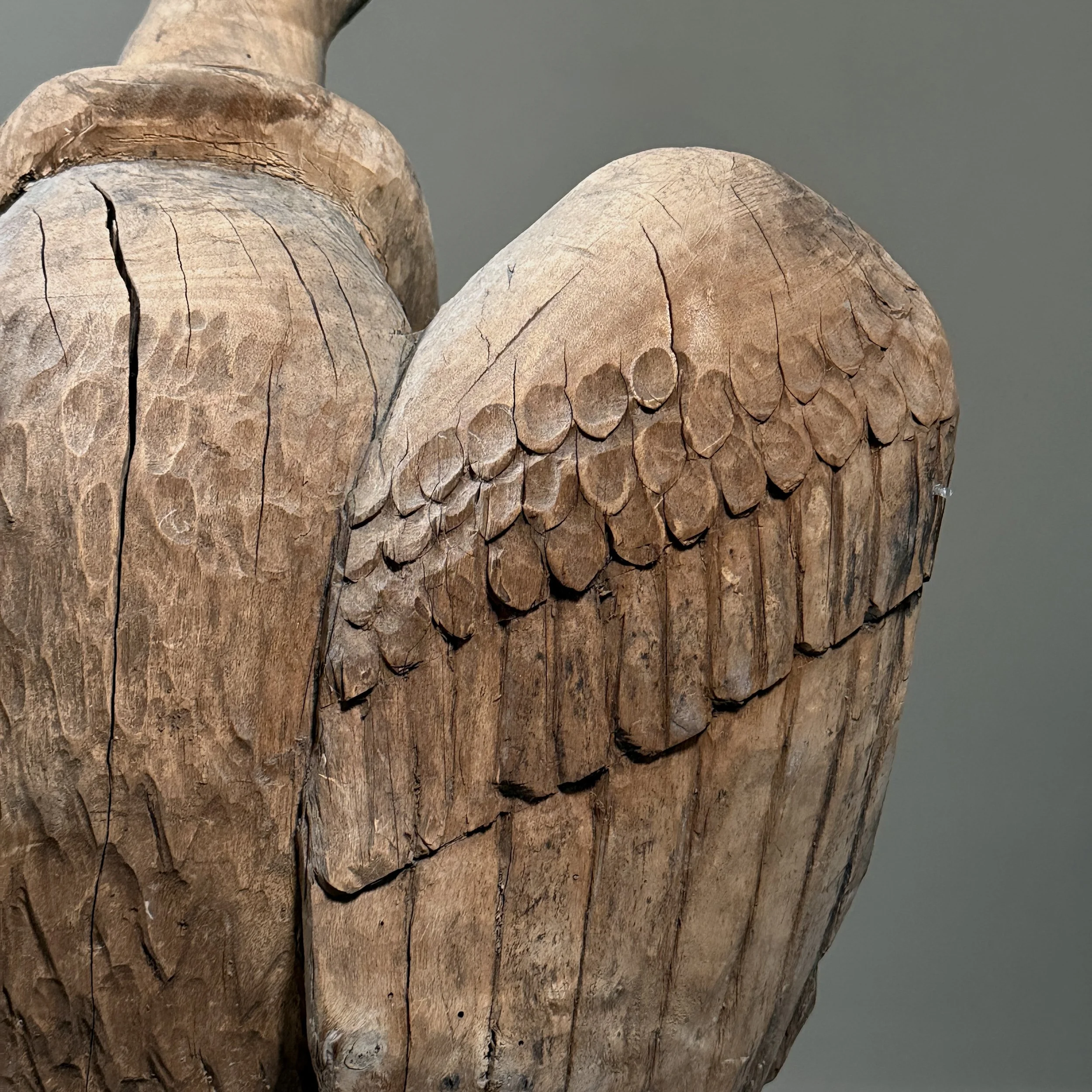 Monumental folk art bird carving wing detail