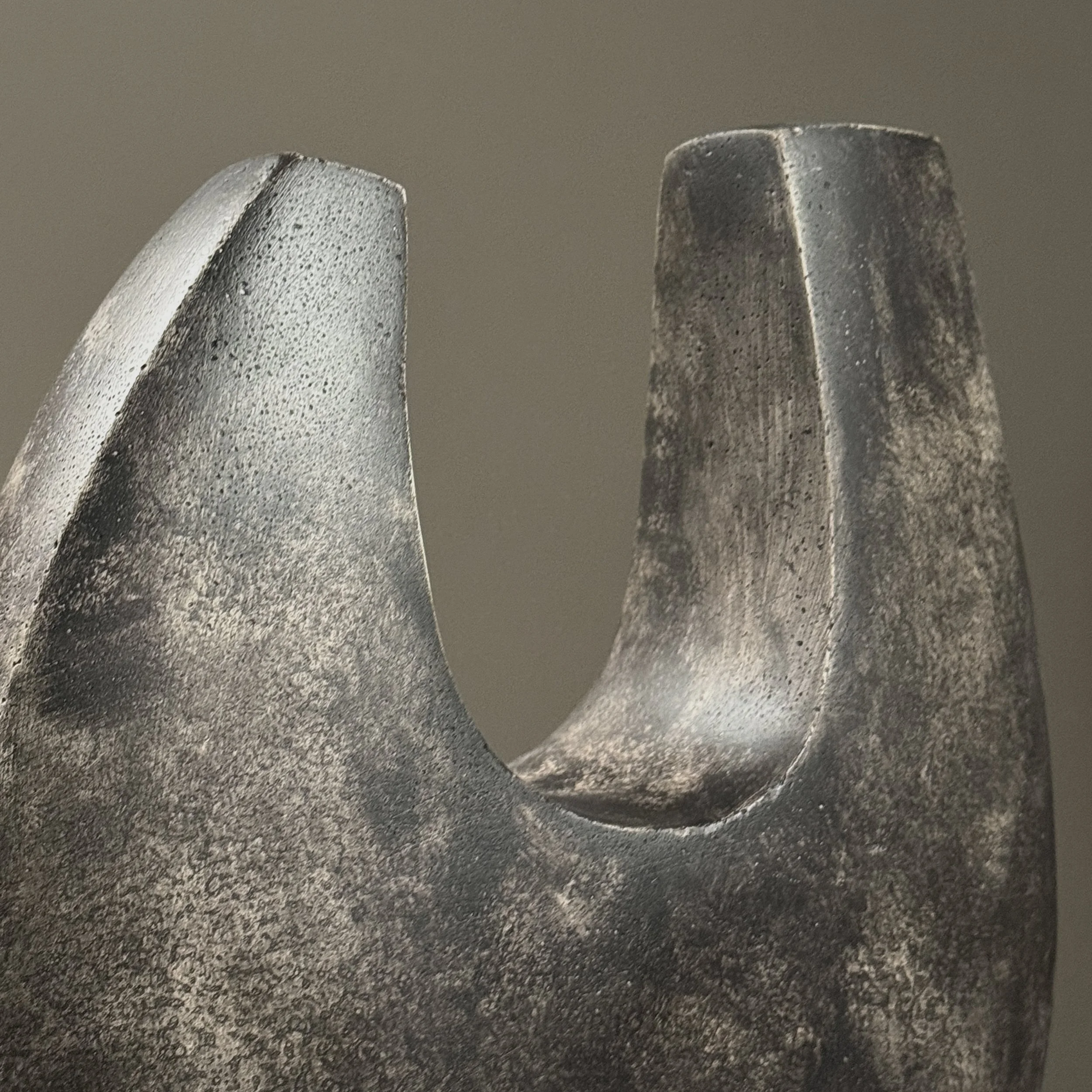 Macro detail of the cement surface texture and subtle tonal variations in the patina