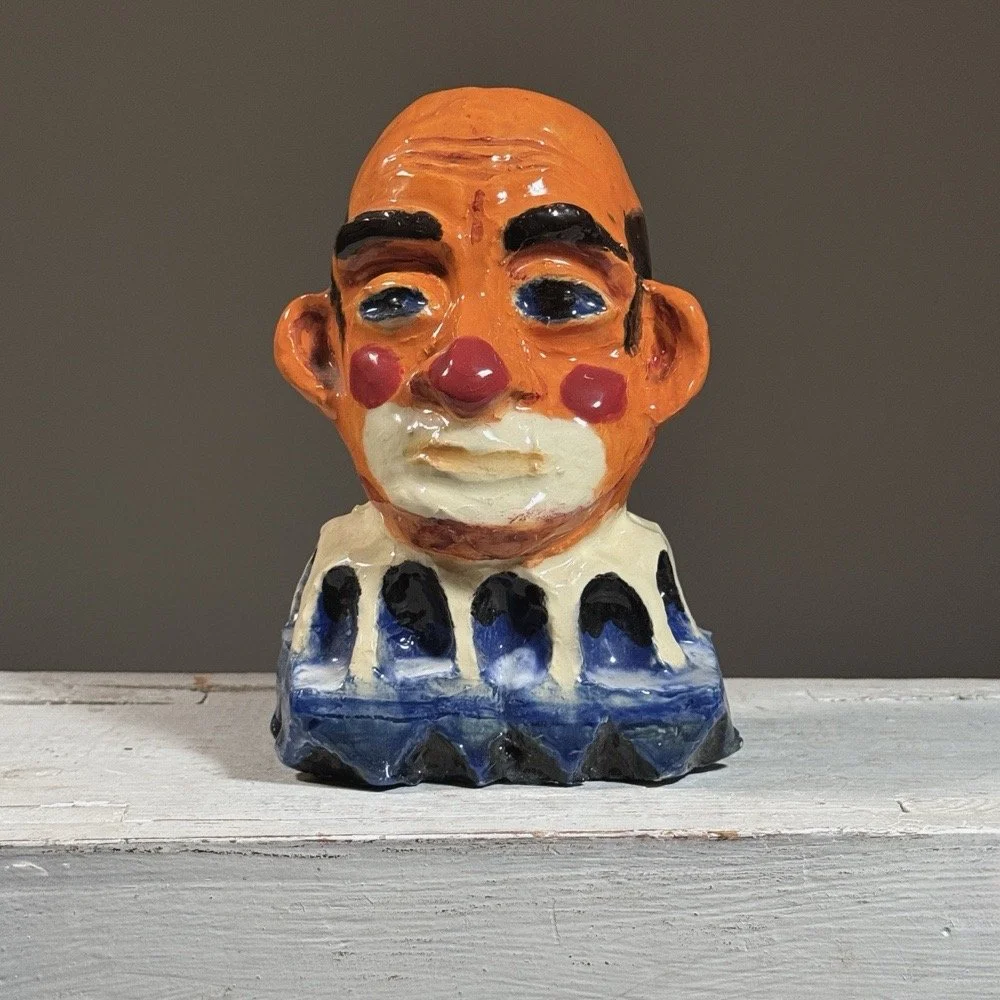 Full frontal view of a vintage expressionist polychrome plaster clown bust by Jack Gerber