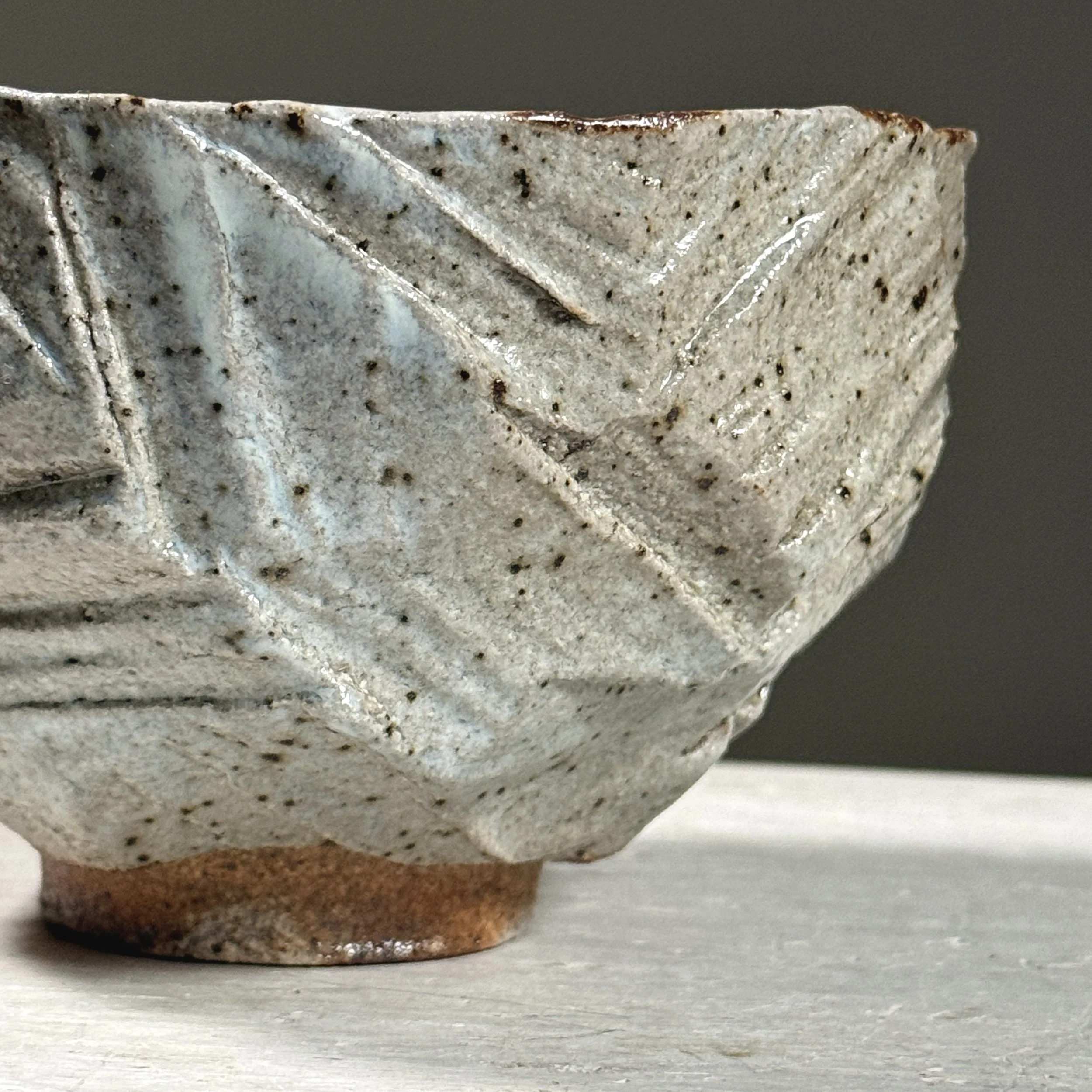 Detail of geometric carved and hacked patterns on the exterior