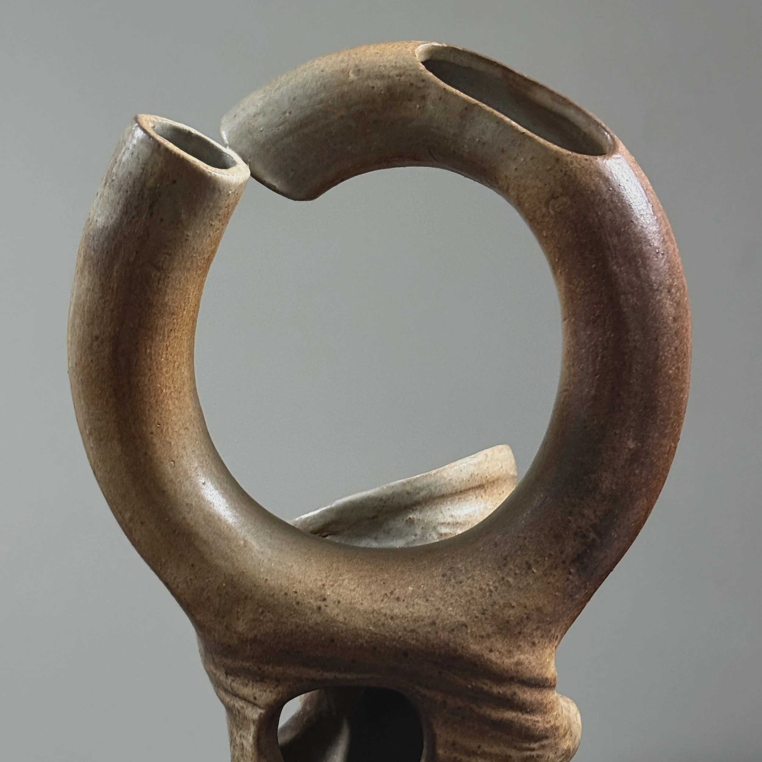 Broken circle handle detail, deconstructed ceramic vase