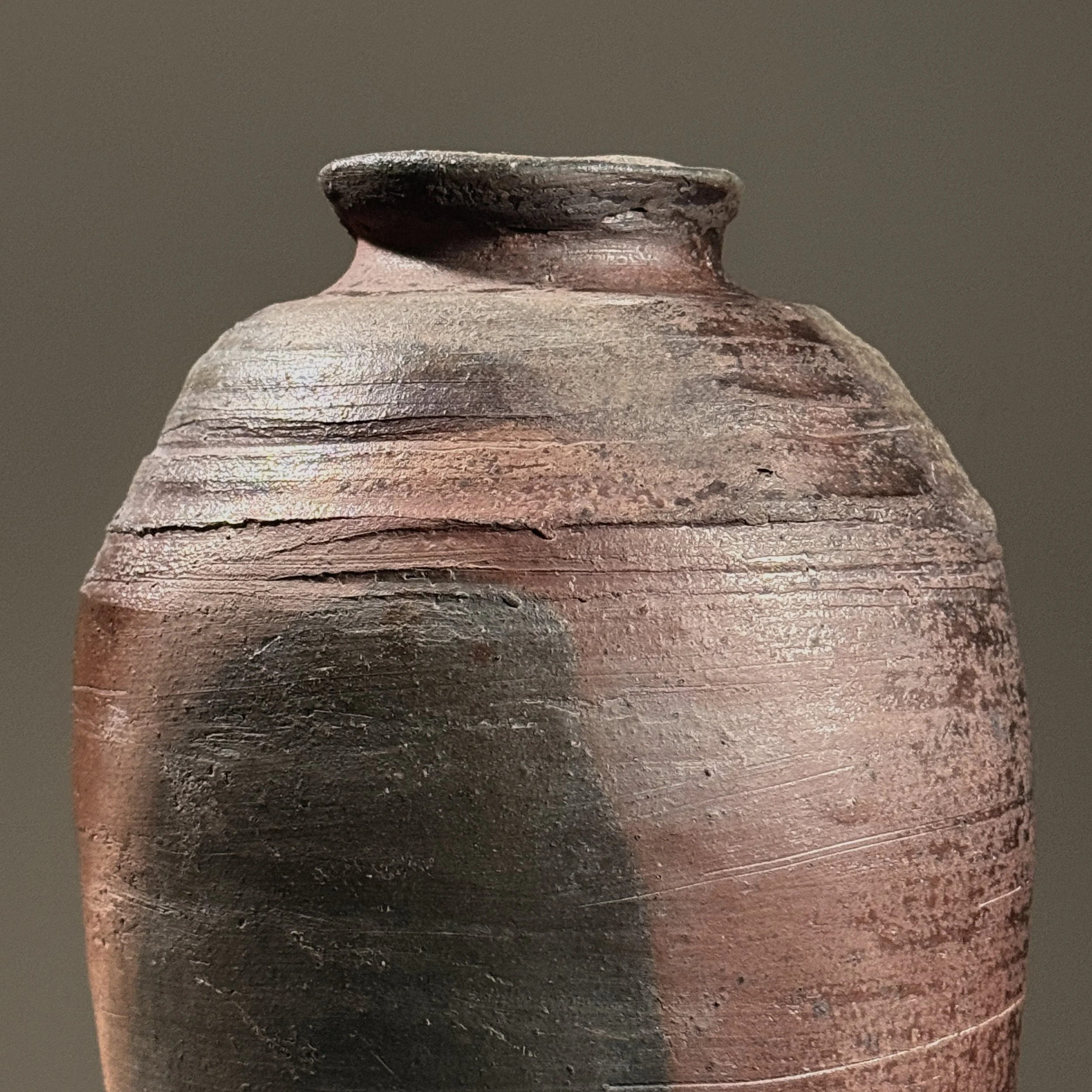 Close-up of hand-built construction and textured surface.