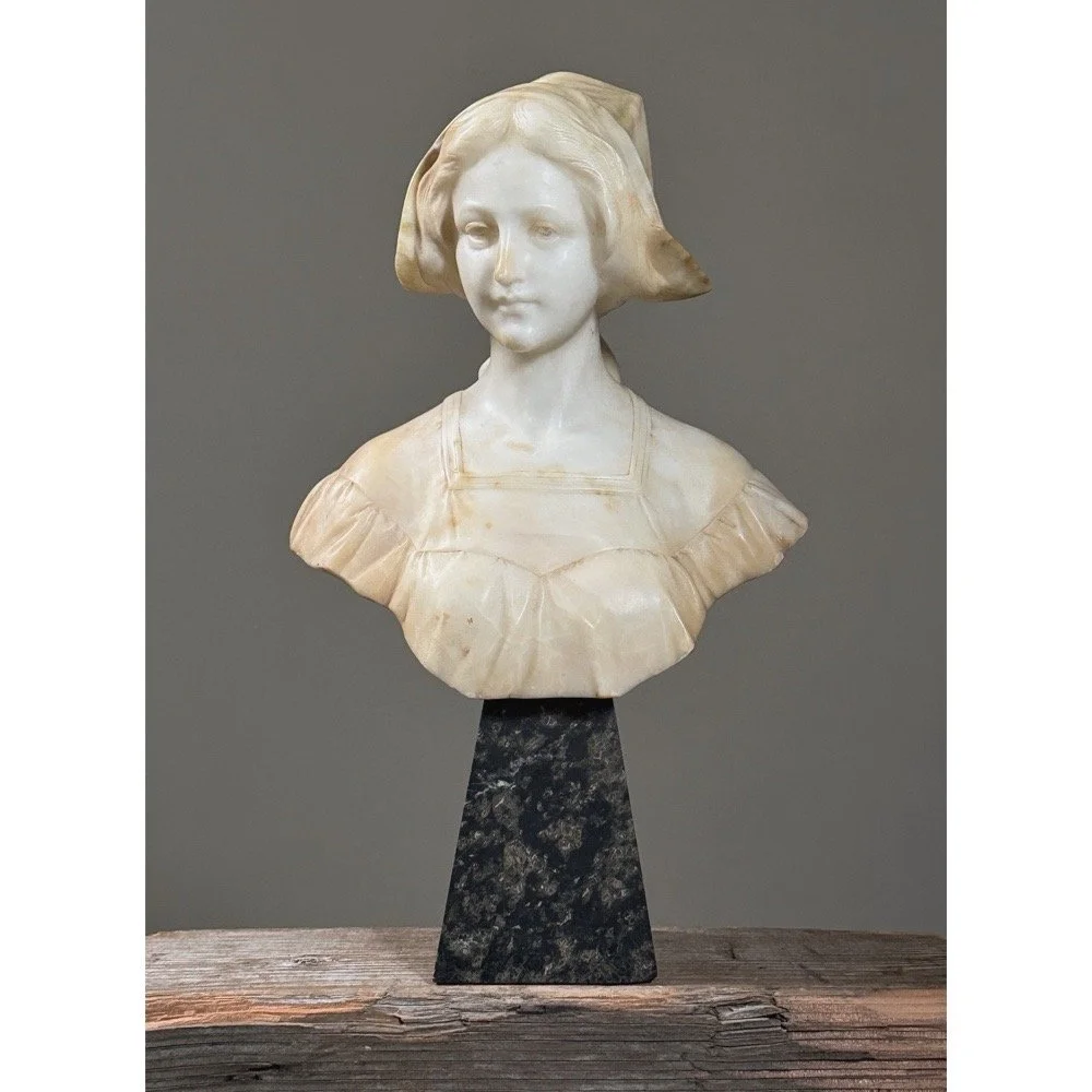 Full frontal view of the Art Nouveau alabaster bust of a woman on its marble base.