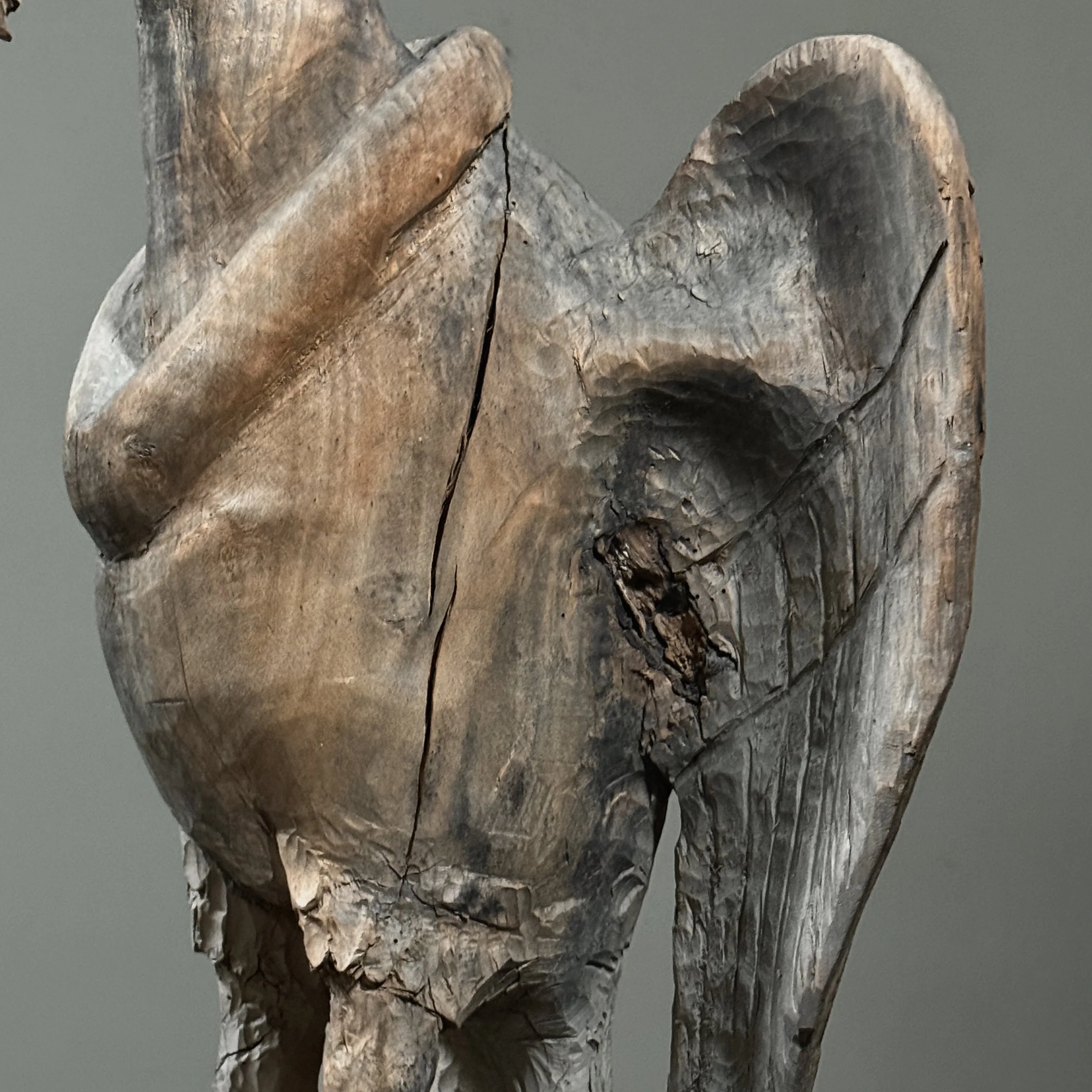 Monumental folk art bird carving wing detail