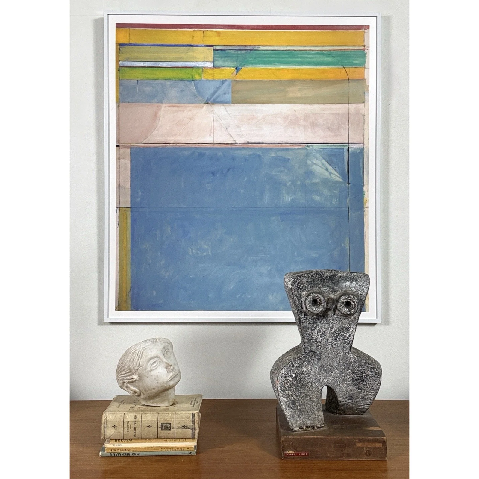 Framed pigment print by Richard Diebenkorn titled "Abstract Landscape," displayed on gallery wall around objects.