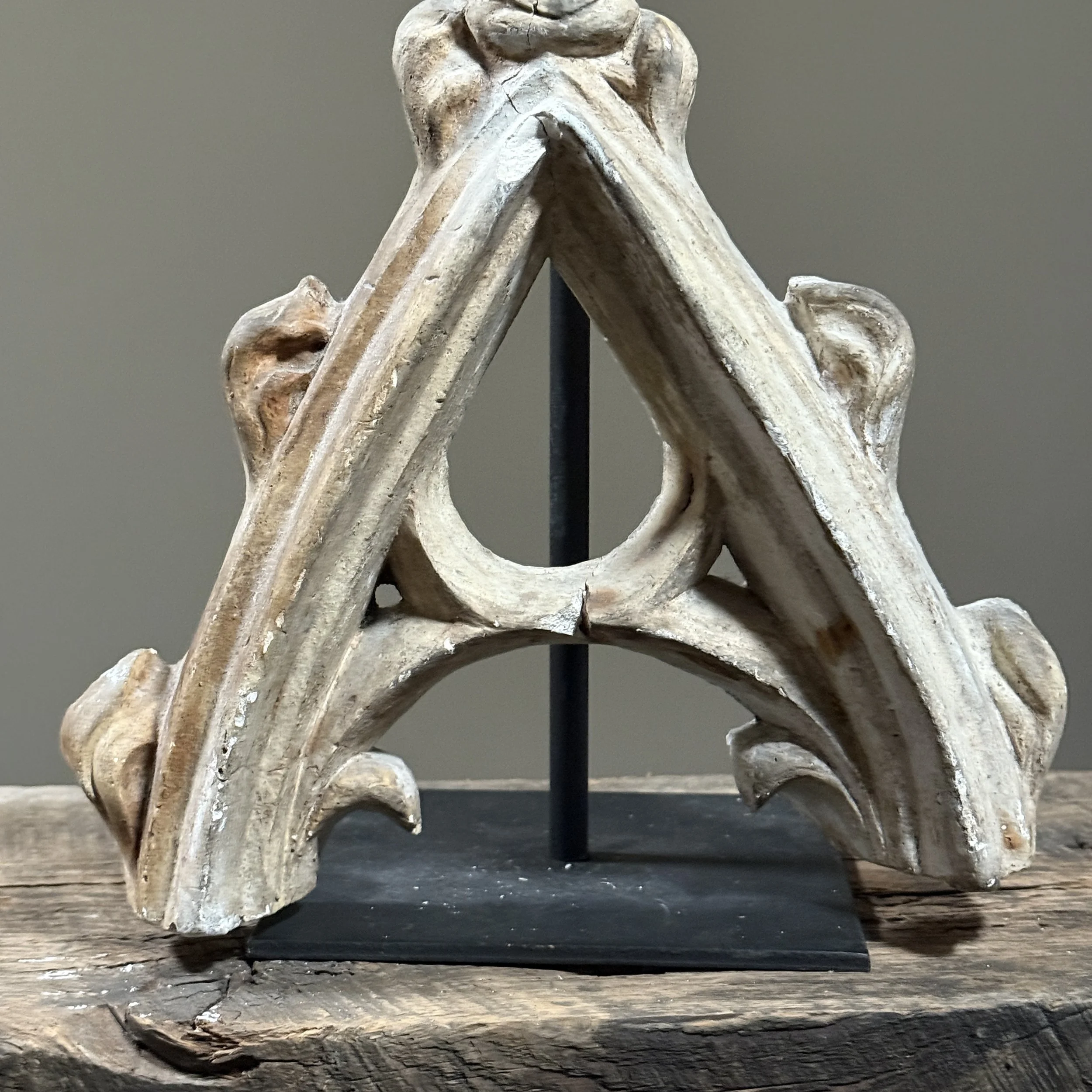 Weathered plaster arch remnant with timeworn patina