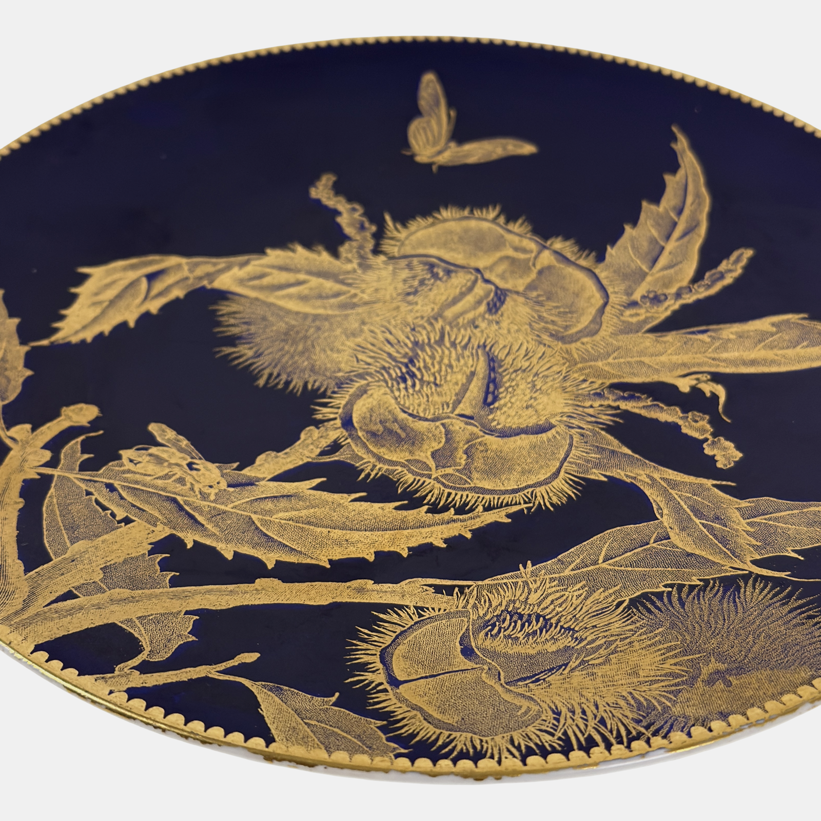 Pair of Brownfield English porcelain Aesthetic period plates, cobalt and gold, chestnut and peach motifs