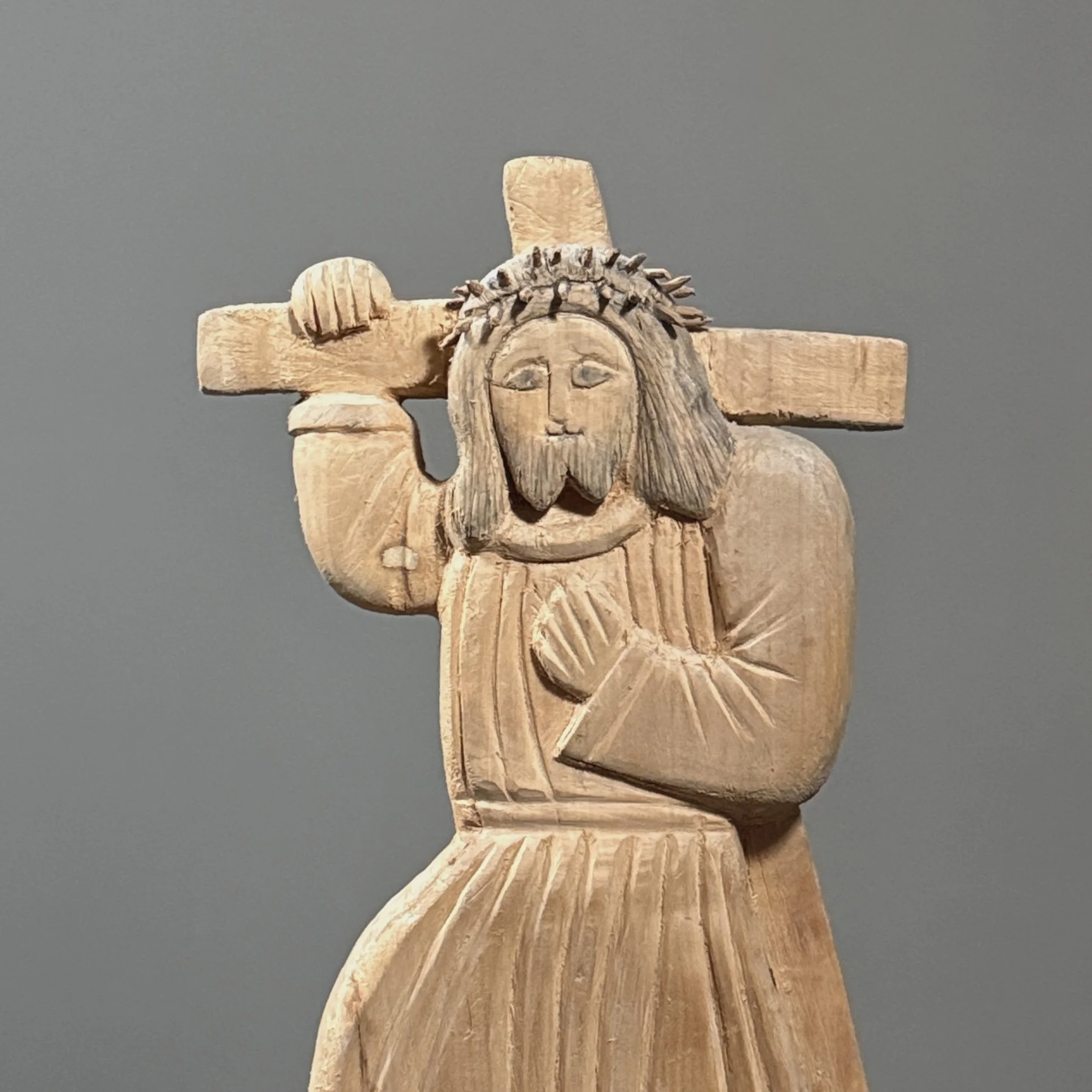 Close-up of facial features and carving detail of Christ.