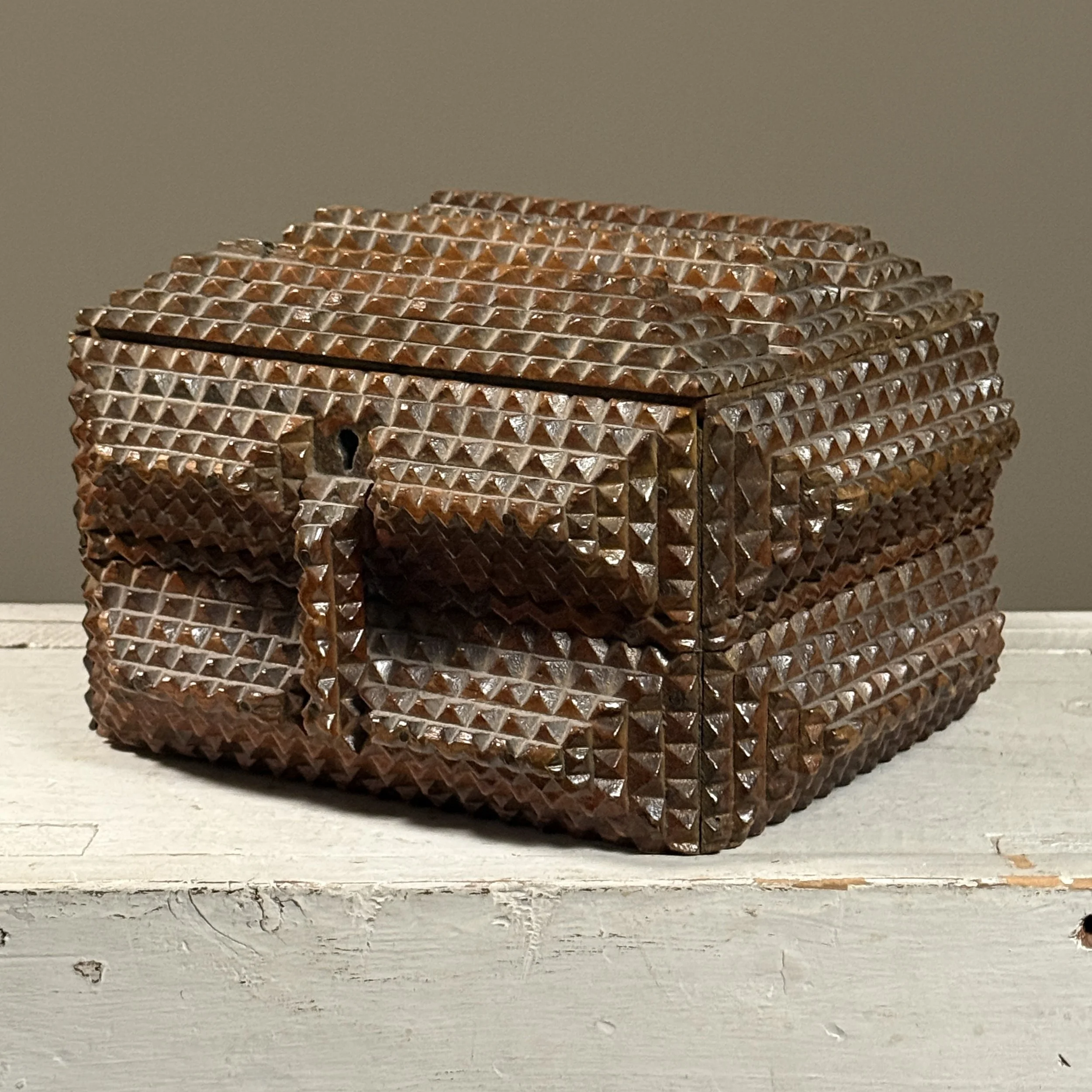 Antique tramp art box with five layers of chip carving and pyramid details