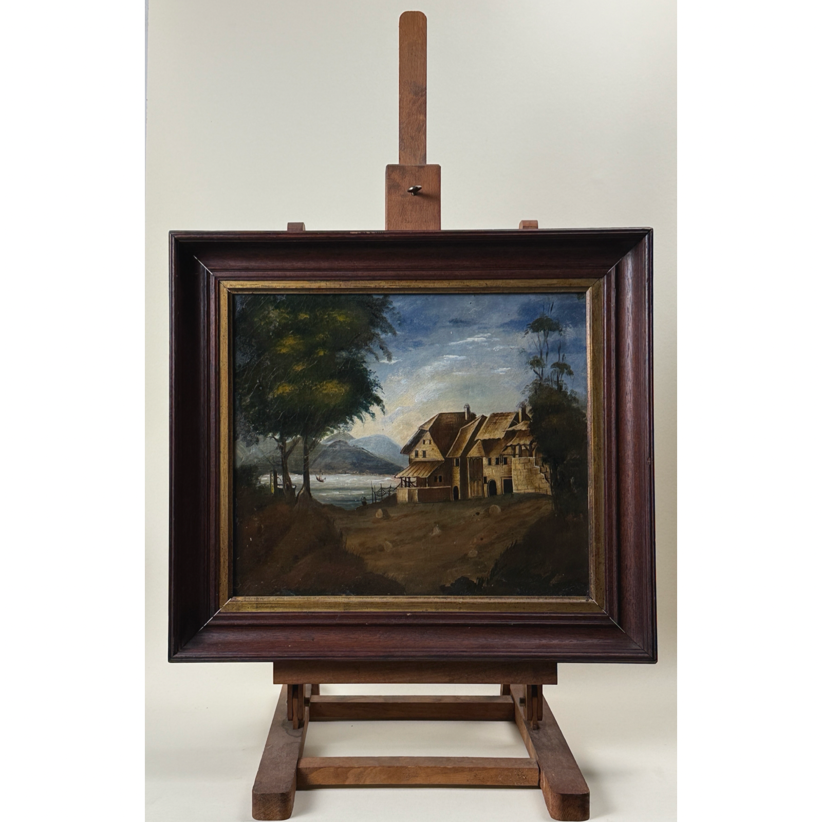 Antique folk art seascape with cottage. Oil on canvas. 18.5 inches wide by 16.5 inches high.