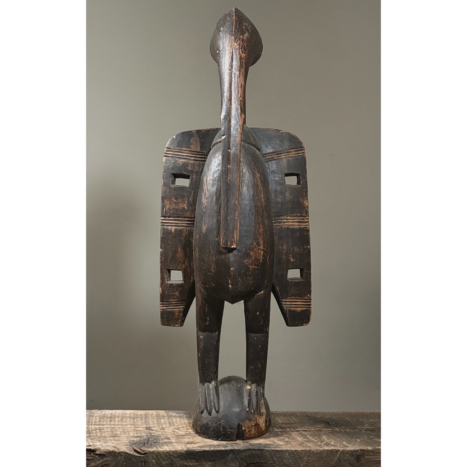 Dark wood Calao bird sculpture with outstretched wings