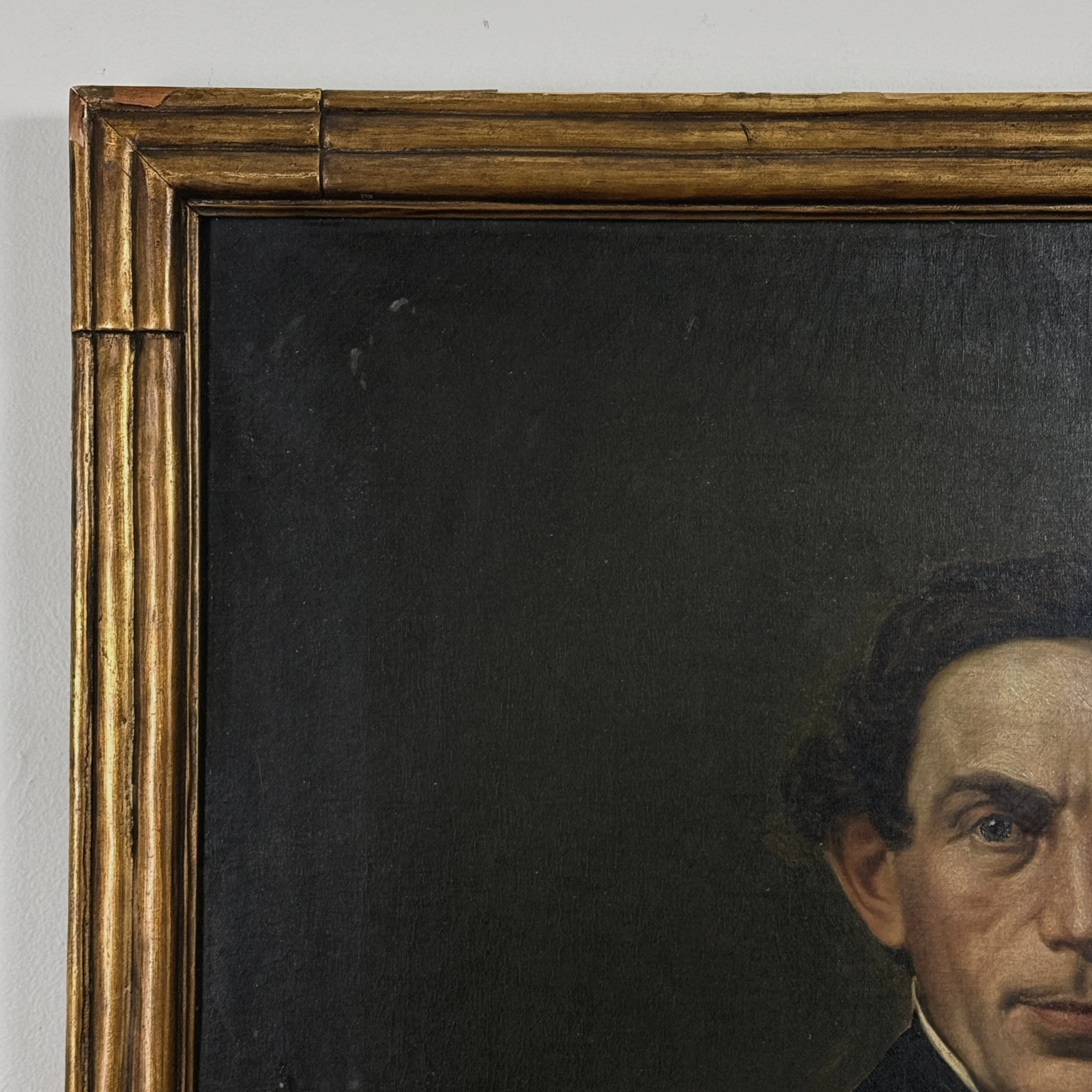 Close-up of paint loss and cracking in the portrait's upper right quadrant.