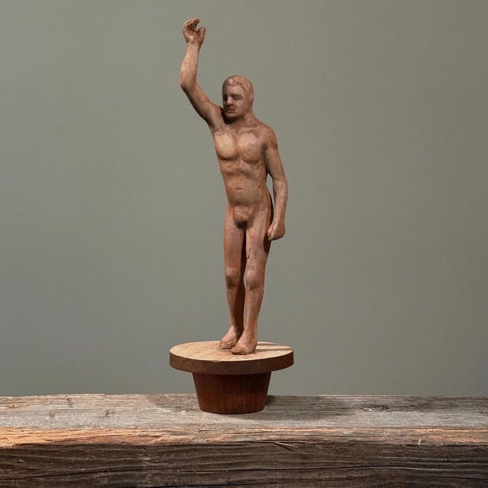 Vintage folk art hand carved male nude sculpture on tapered stand