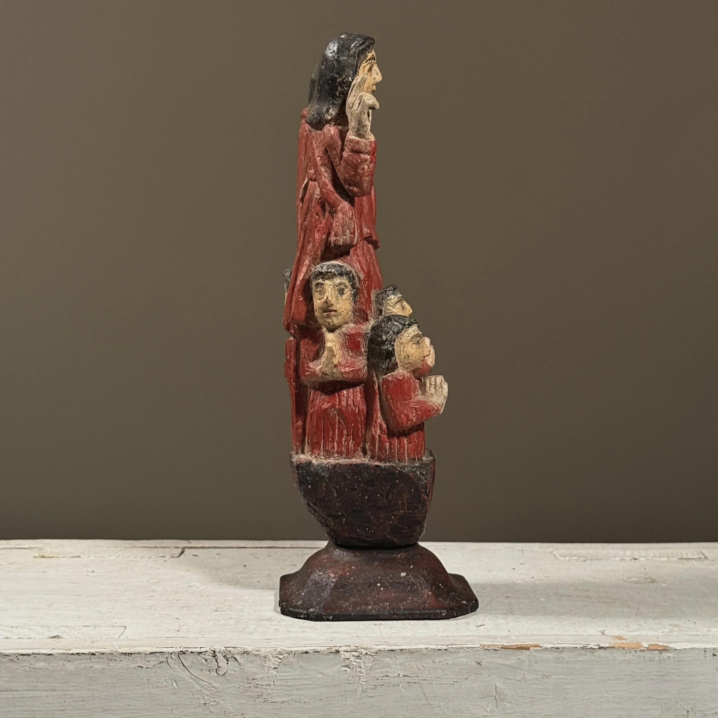 Spanish Colonial devotional carving showing man, woman, and children